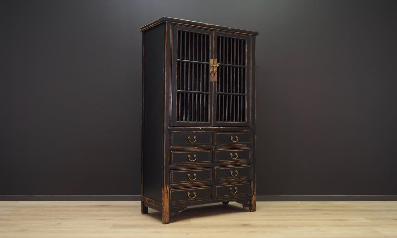 Unique cabinet from the 1980s, a Minimalist form stylised with intentional aging, giving an incredible effect. Made of wood covered with black paint. The key in the set. Maintained in good condition, directly for use.

Dimensions: Height 168 cm,