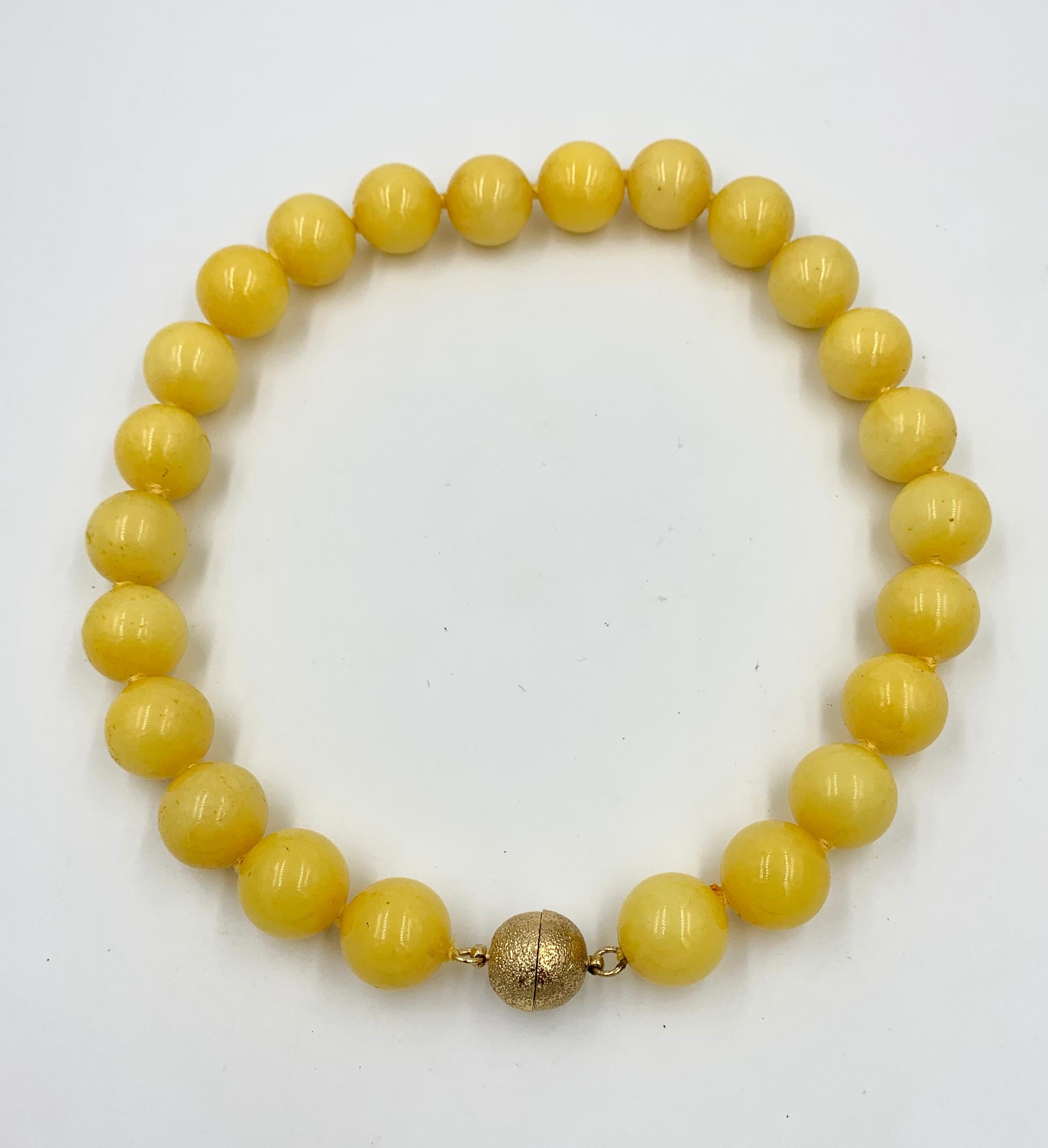 A stunning Yellow Chalcedony Bead Necklace with 20 mm (3/4 inch) wide Chalcedony beads.  The dramatic statement necklace with the large beads in vivid yellow is just fabulous.  The necklace is 19.5 inches long and it has a gold filled magnetic ball