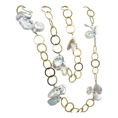 Retro Yellow Gold 36-Inch Keshi Pearl Opera Circular Ring Necklace Circa 1990