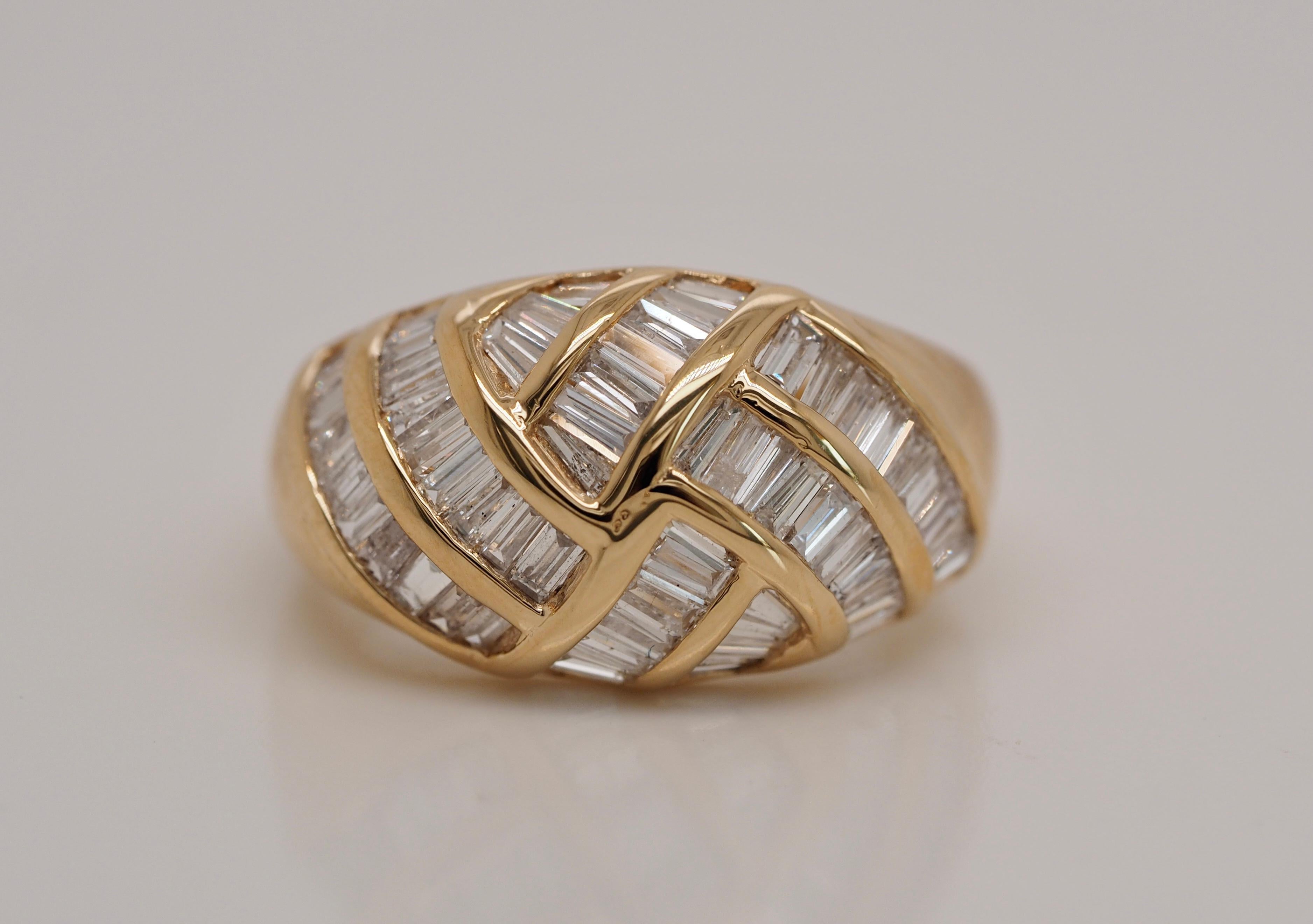 14 Karat Yellow Gold Diamond Baguette ring! This retro-vintage style is an absolute must. Its is perfect for every occasion. The baguette diamonds are set in a diagnal design creating an incredible brilliance. This a a true classic ring that will