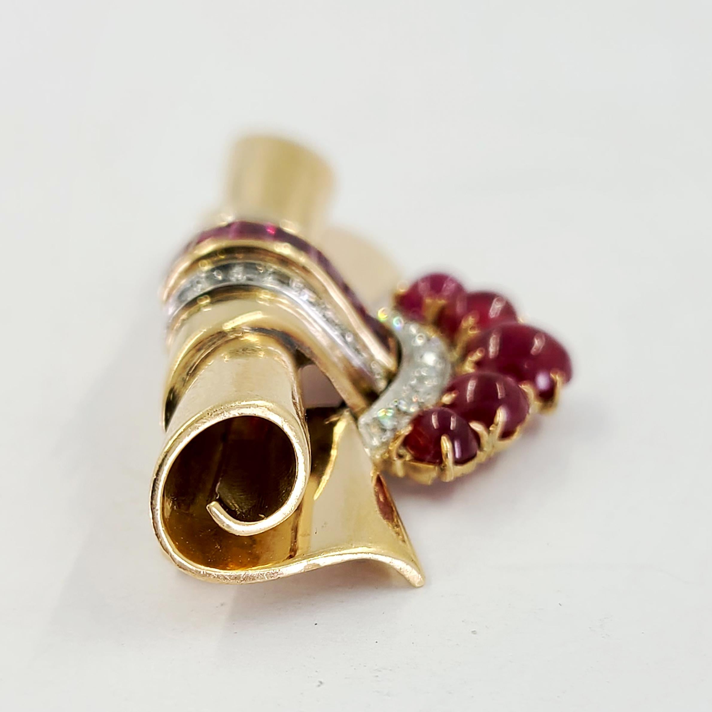 14 Karat Yellow Gold Scroll Brooch/Pin Featuring 12 Cabochon & Square Cut Rubies Totaling Approximately 1.00 Carat & 24 Single Cut Diamonds Of VS Clarity & G/H Color Totaling Approximately 0.50 Carat. 10 Karat Yellow Gold Pin Attachment. Finished