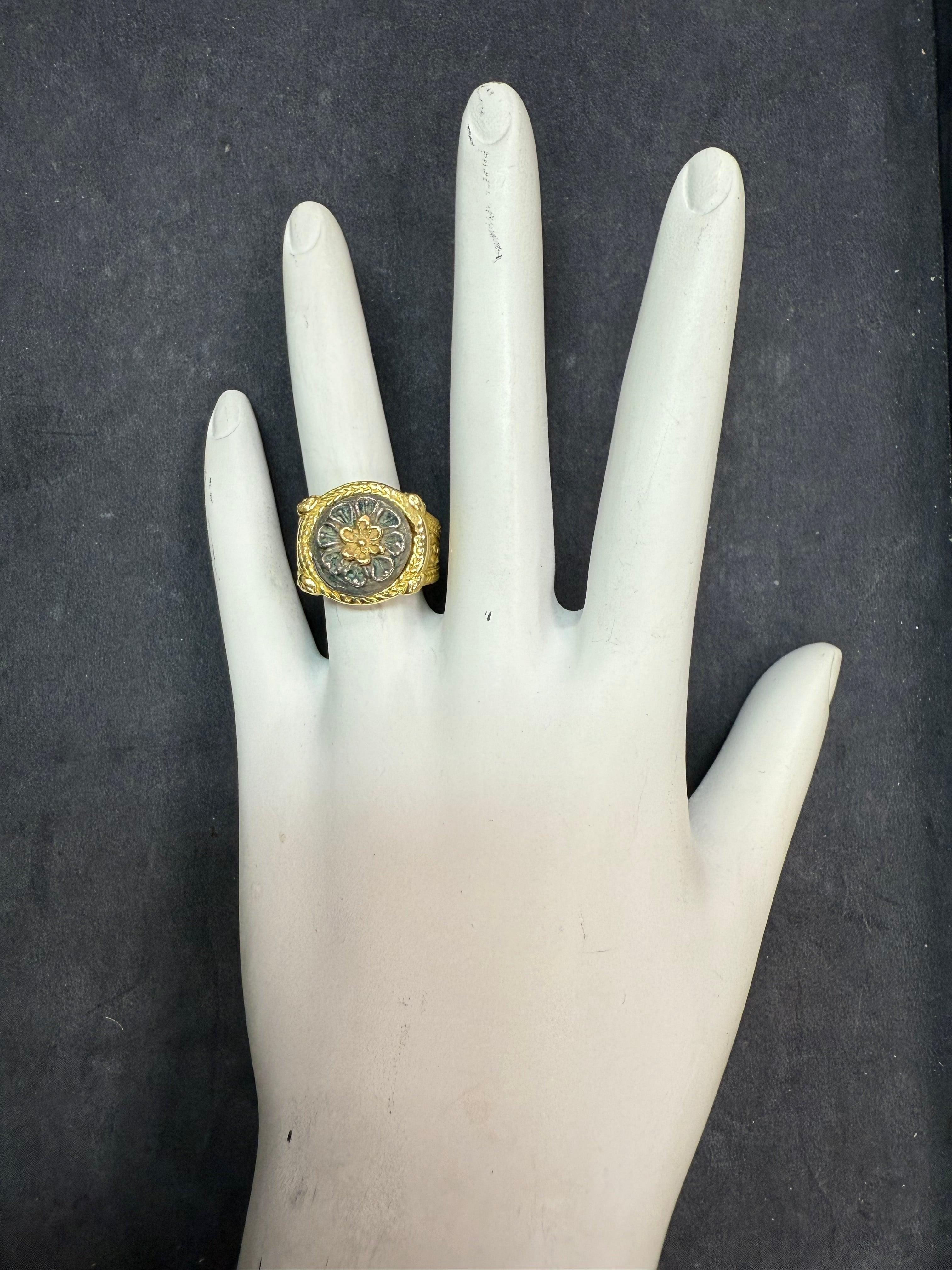Retro gold floral petal medallion-style ring, beautifully sculpted and substantial in form. The ring weighs 13.2 grams, is a size 4.75, and measures 15.5 mm across the top, tapering to 3.2 mm at the base. Circa 1985.
Three Disclaimers / Special