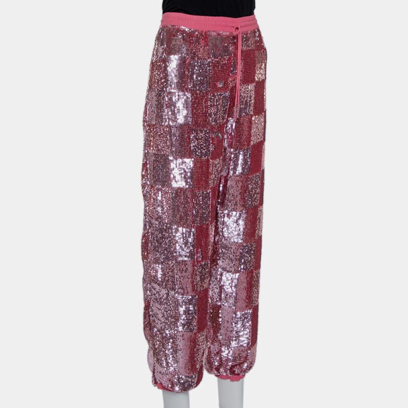 Get a statement look with these joggers from Retrofete. Designed with sequins laid in a check pattern  the joggers bring glamour to a casual style staple. The pair in pink is complete with a comfortable waistband.