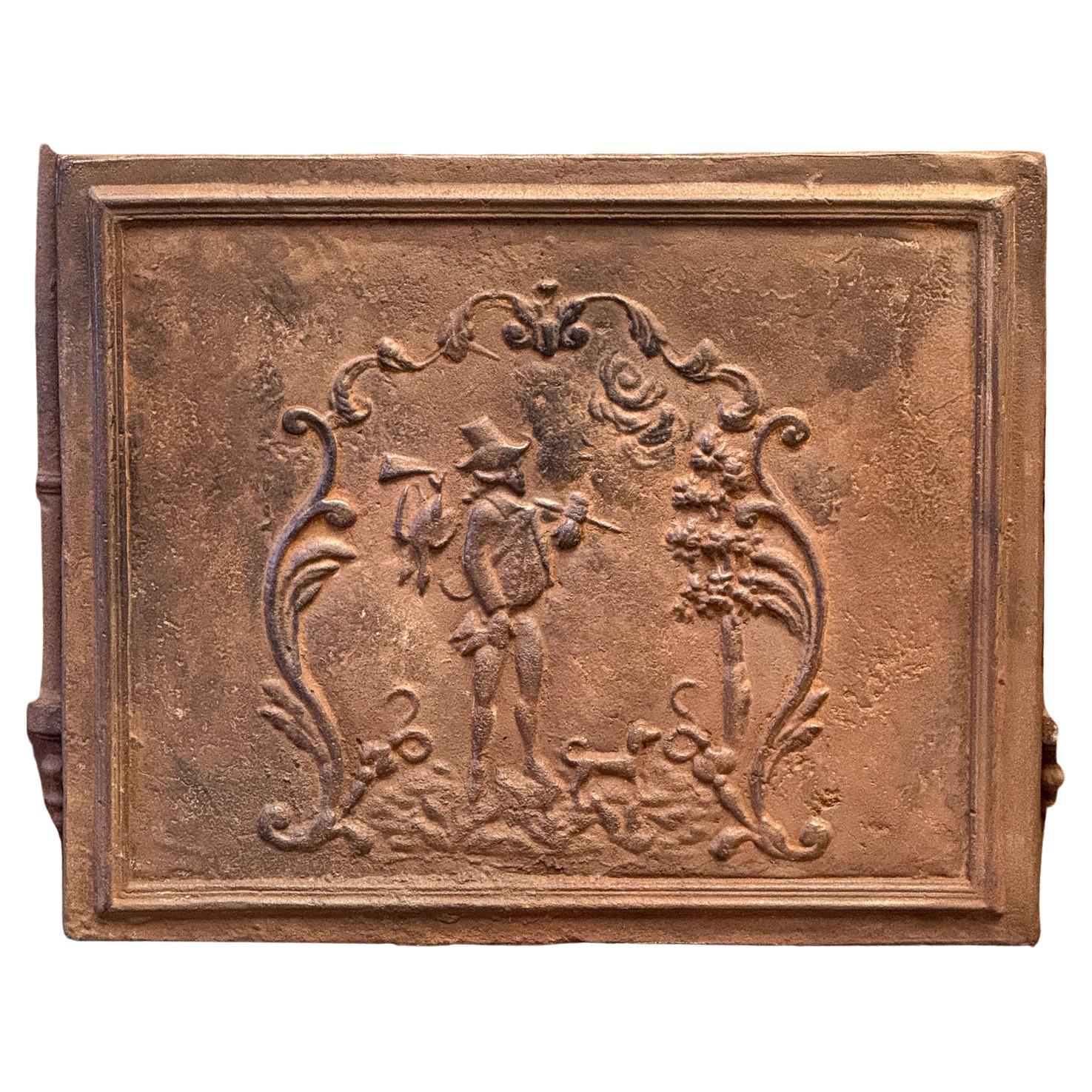20th century Napoleon III style fireback with a scene of a hunt returning.

The fireback has a natural brown patina. Upon request it can be made black / pewter color with stove polish at no extra cost.  
