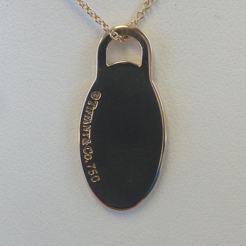 TIFFANY & CO. Solid 18k Yellow Gold Return to Tiffany Oval Tag Necklace

17.0 Inches in length

Return to Tiffany Oval Dog Tag charm

Tiffany & Co. Chain

Guaranteed Authentic Tiffany & Co