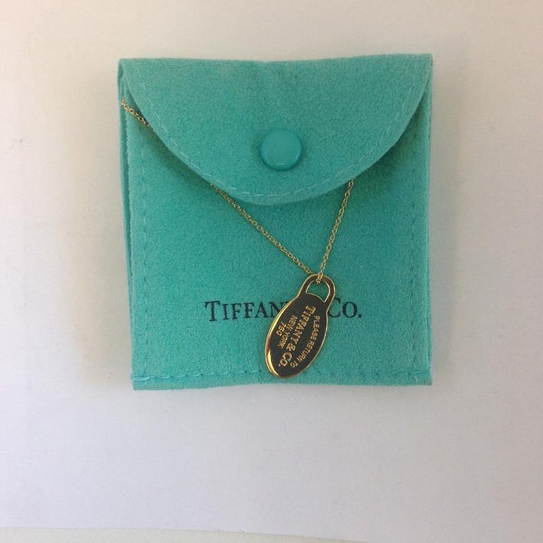 Return to Tiffany and Co. 18 Karat Yellow Gold Oval Dog Tag Necklace