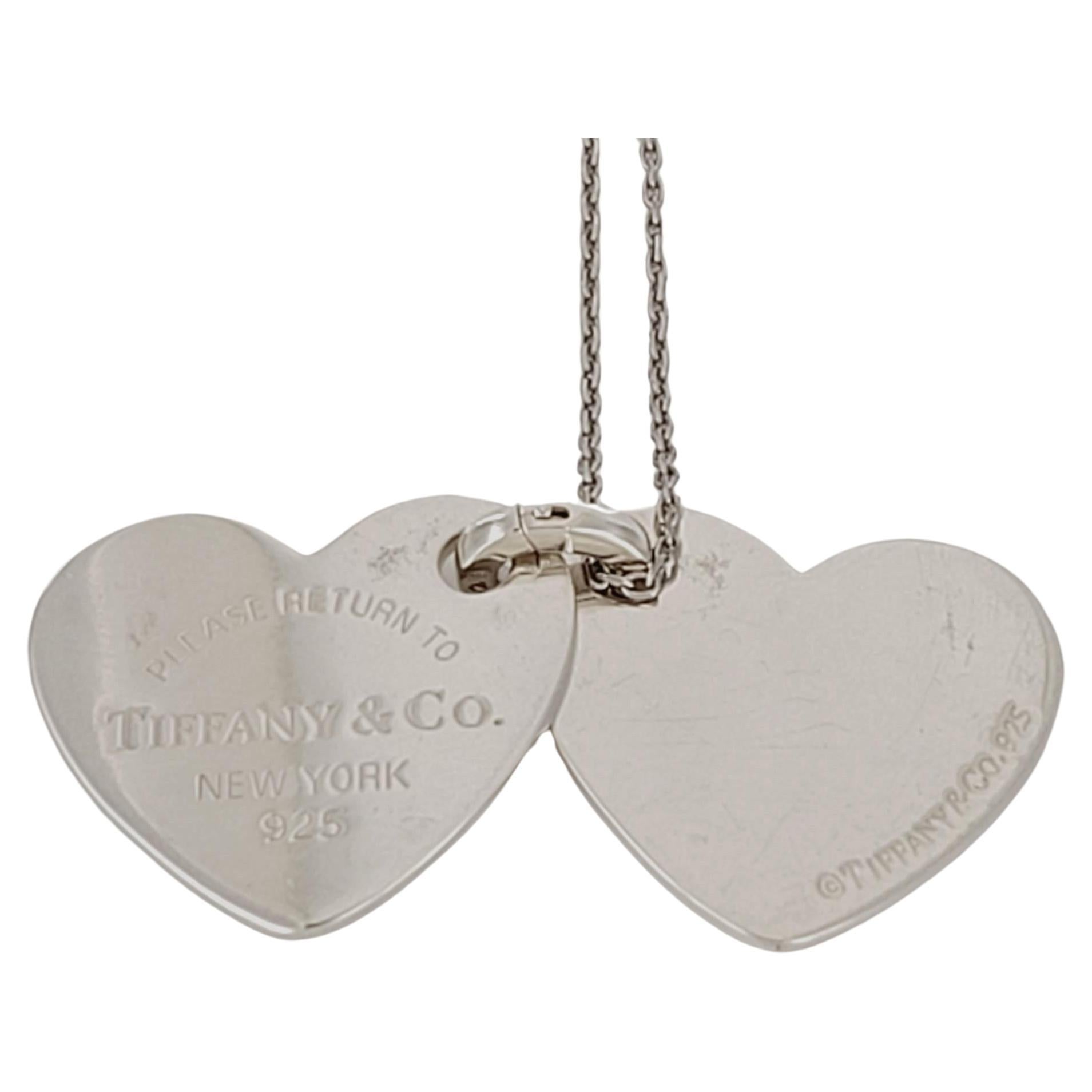 Brand Return To Tiffany & Co
Double Heart Charm Necklace
Material Sterling Silver925
Chain Length 18'' Long
Pendant Dimension 16mm X 18.4mm
Weight 12.0 gr in total
Condition Pre-owned  
Comes with Tiffany & Co Pouch