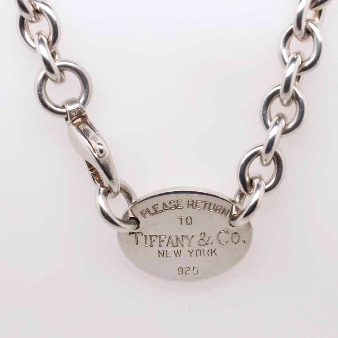 A fine designer silver choker.

By Tiffany & Co.

In sterling silver.

The round tag reads 
