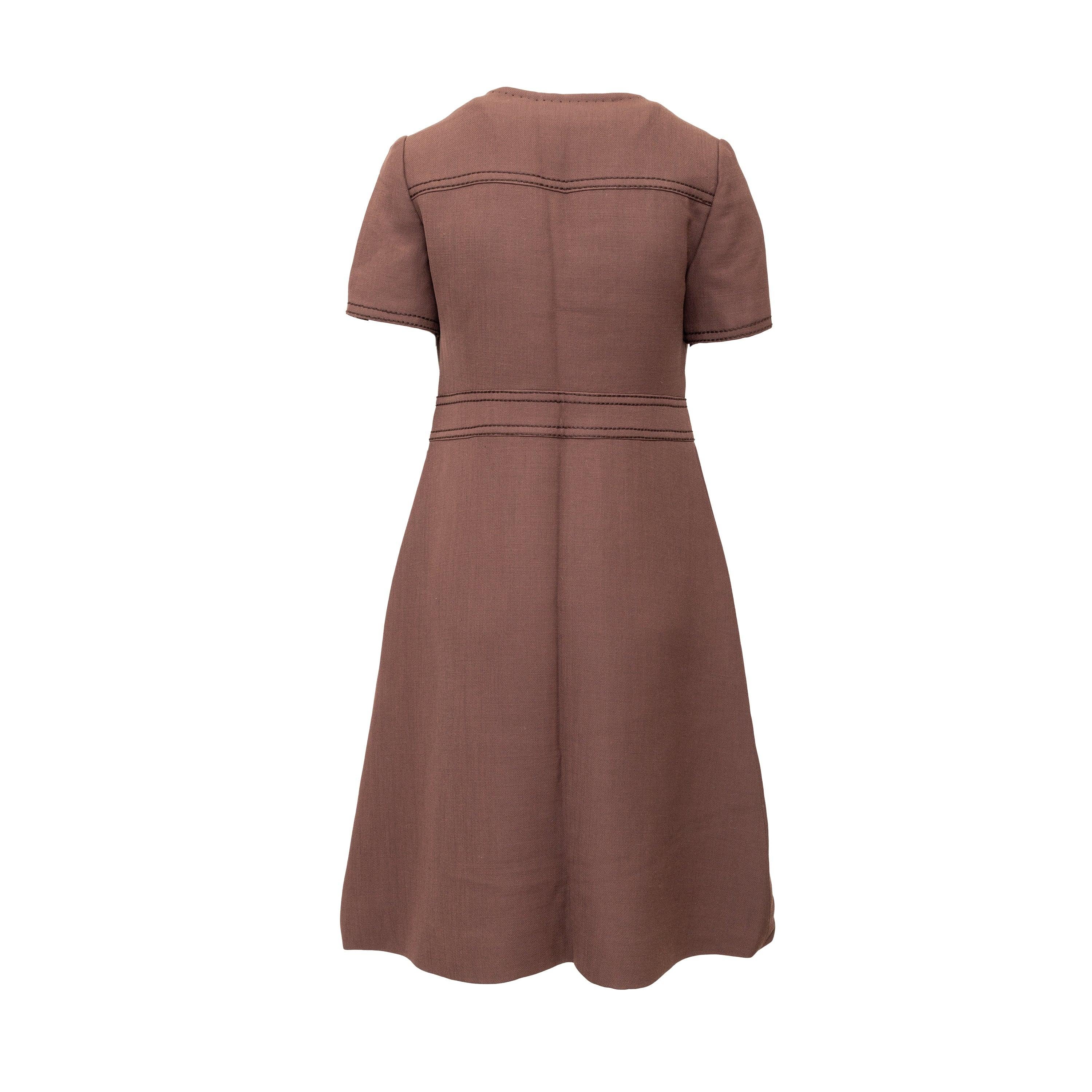 Made with a luxurious cotton blend fabric, this 70s midi dress features a round collar, short sleeves, a zippered front, and faux pocket detailing. Perfect for a vintage yet modern look by Réty Couture.
 Remarks: There are some stains under the arm