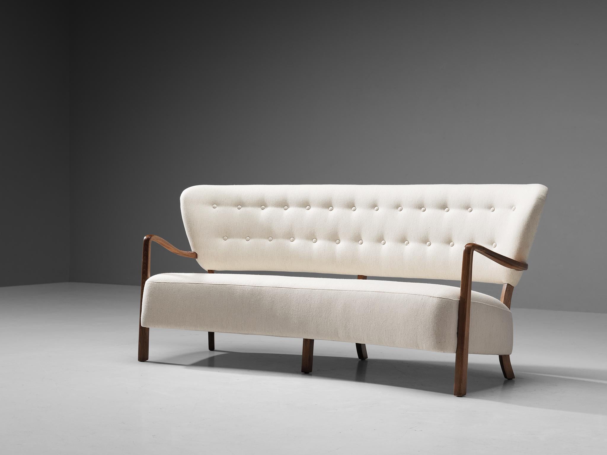 In the manner of Viggo Boesen, sofa, fabric Gabriel 'Savak', stained beech, Denmark, 1940s 

This charming sofa is designed in the manner of Danish designer Viggo Boesen (1907-1985), whose oeuvre is marked by organic movement and the use of honest,