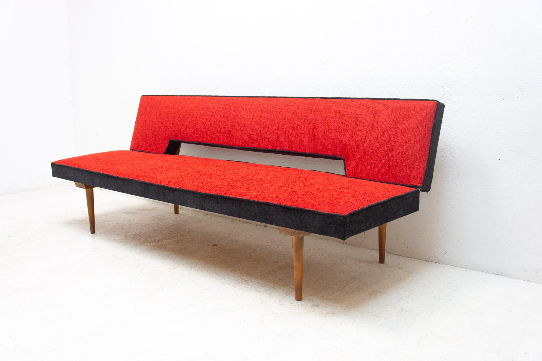Mid-century sofa/daybed, made in the former Czechoslovakia in the 1960´s, designed by Miroslav Navrátil. Material: beech wood, fabric. The sofa is in excellent condition, fully renovated-new upholstery.

Height: 71 cm

Lenght: 196 cm

Depth: