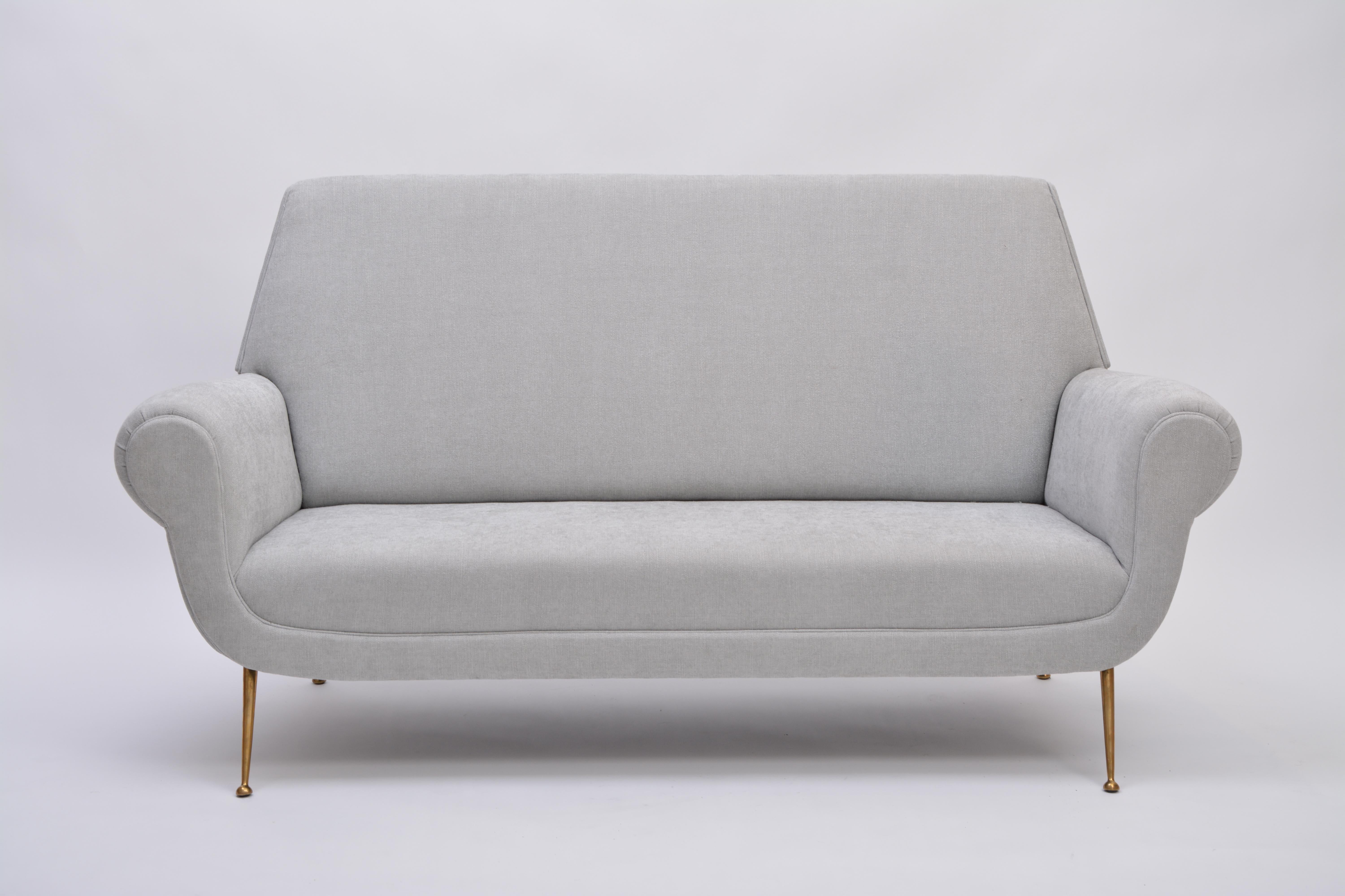 Reupholstered Grey Italian Mid-Century Modern sofa by Gigi Radice for Minotti

This sofa was designed by Gigi Radice for Minotti in the 1950s. It has been upholstered and features brass legs. It is in excellent vintage condition.