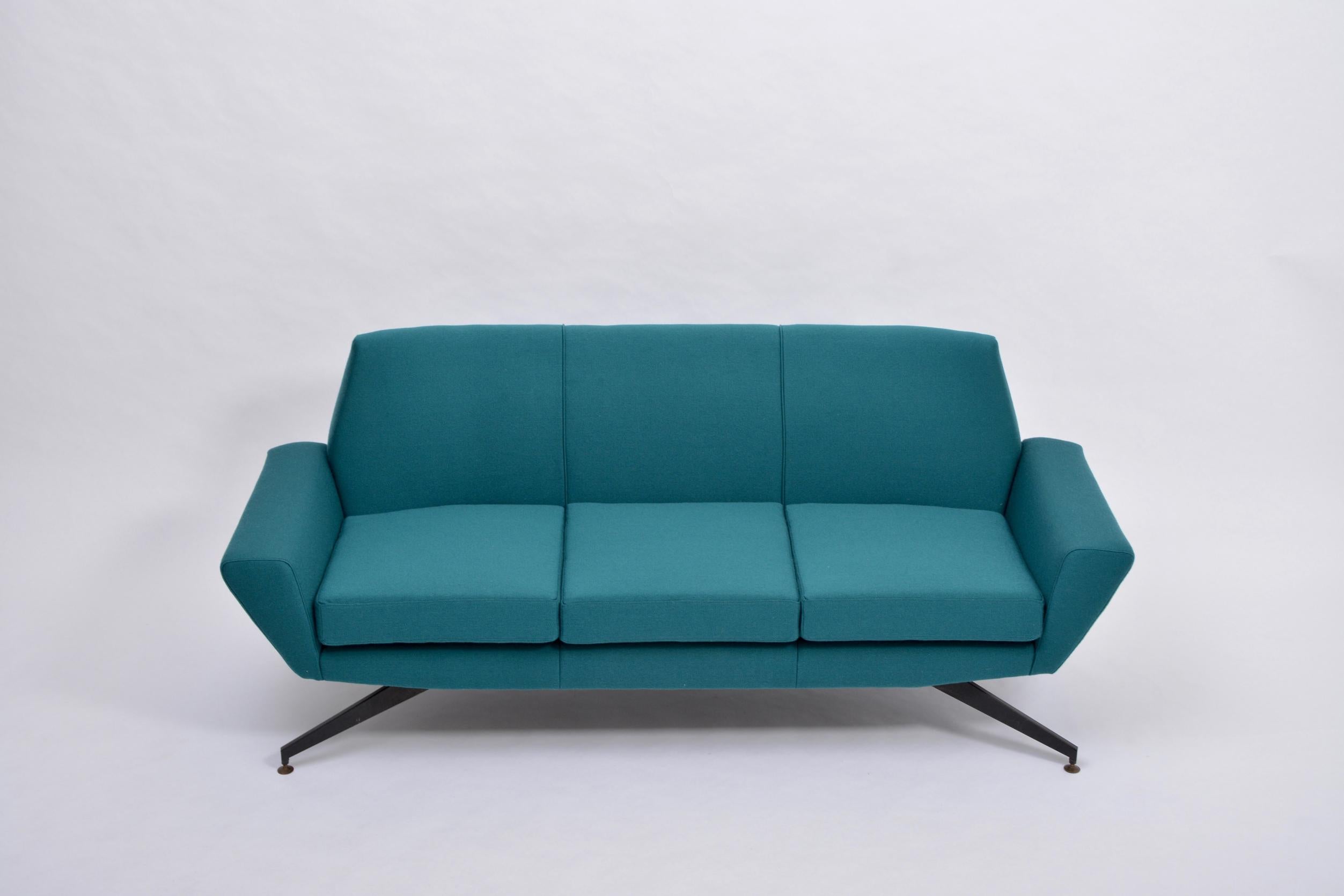 Reupholstered Italian Mid-Century Modern sofa with metal base by Lenzi

This three-seat sofa was produced by Italian company Lenzi in the 1950s. The base is made of lacquered metal.
The sofa has been completely reupholstered in a teal colored fabric.