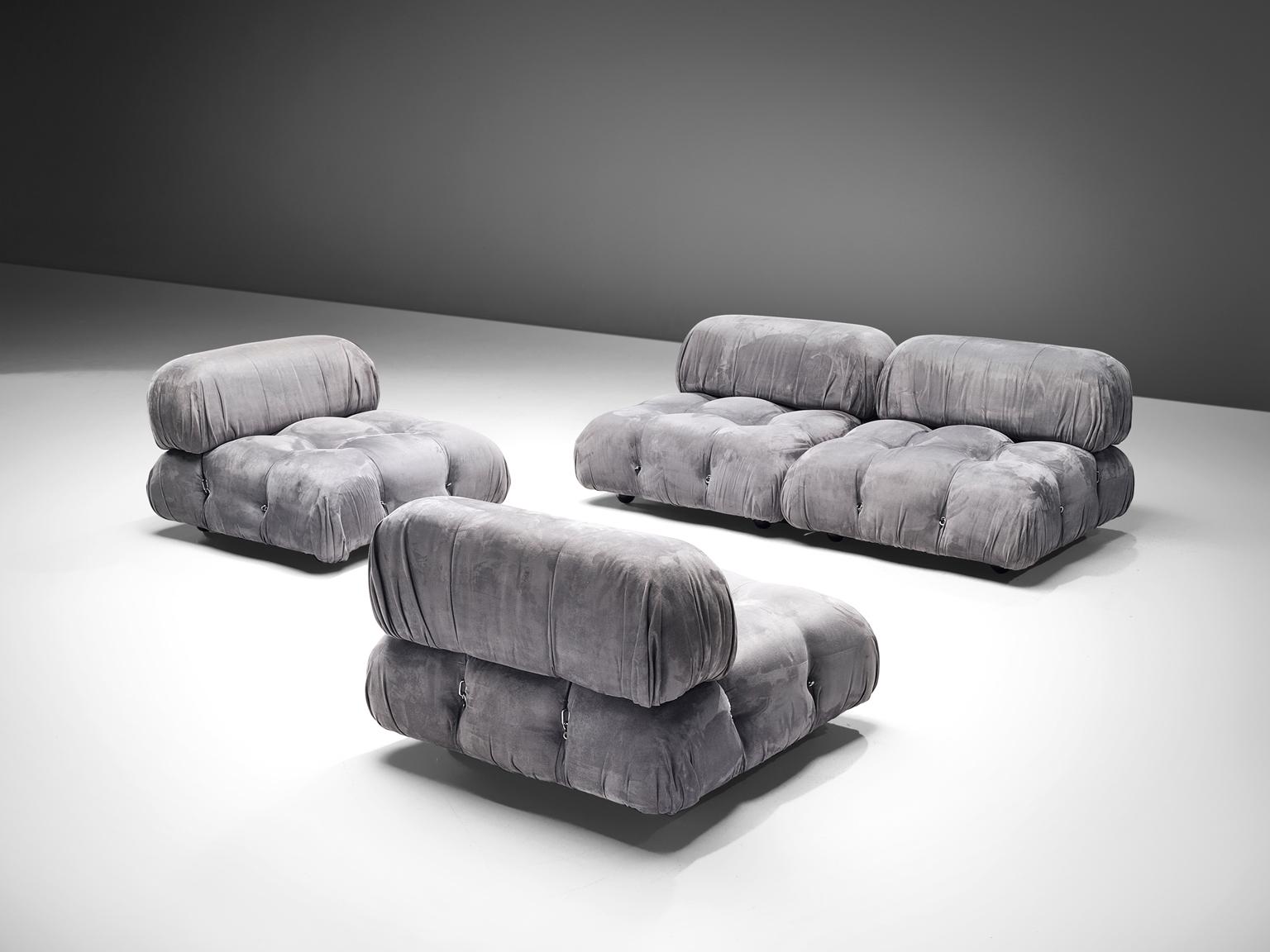 Mario Bellini, modular 'Cameleonda' sofa in grey alcantara fabric, Italy, 1972.

The sectional elements of this can be used freely and apart from one another. The backs are provided with rings and carabiners, which allows the user to create a