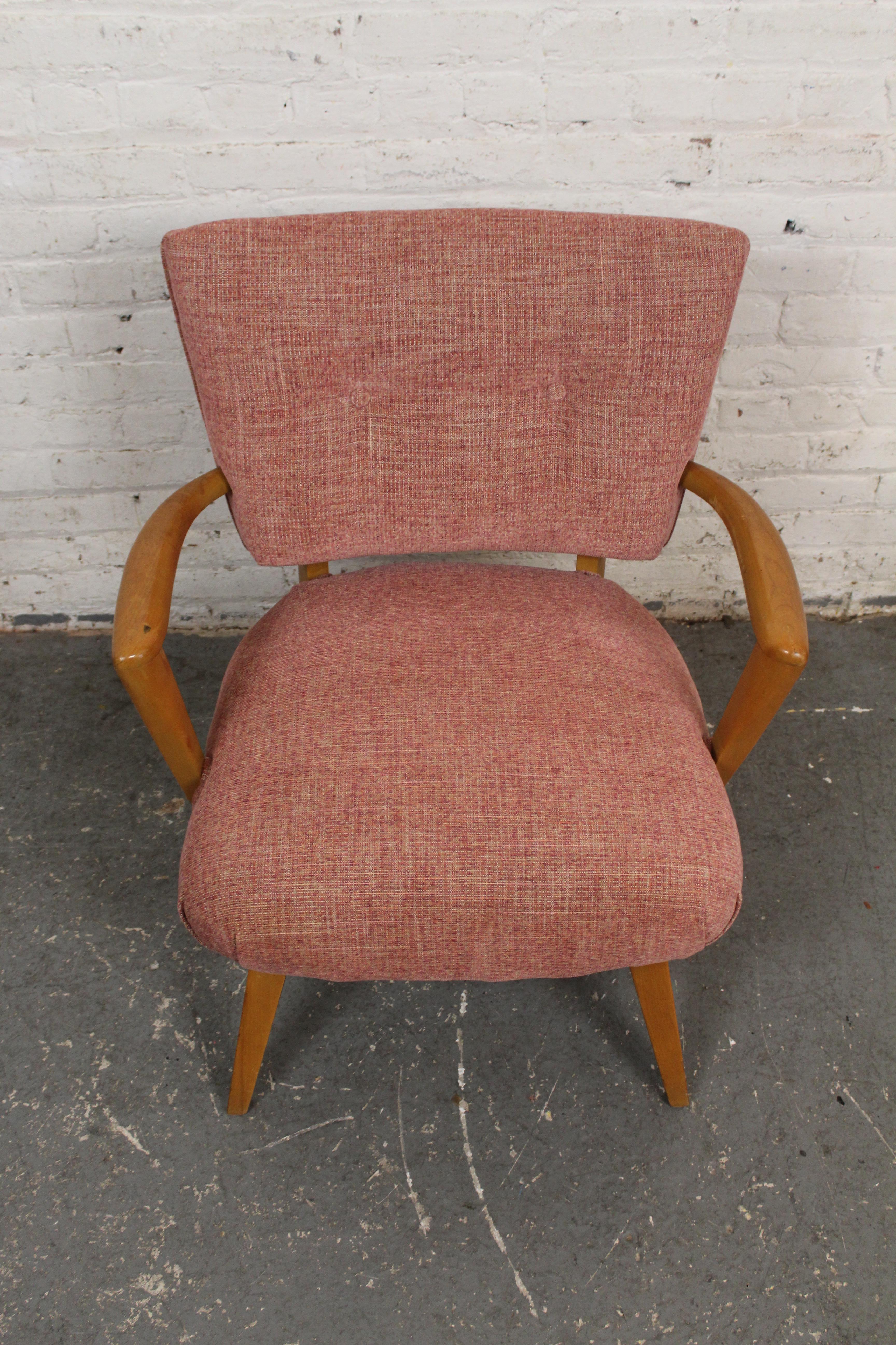 Bring home the timeless vintage modernism of genuine Heywood Wakefield furniture with this beautifully reupholstered Model 569 