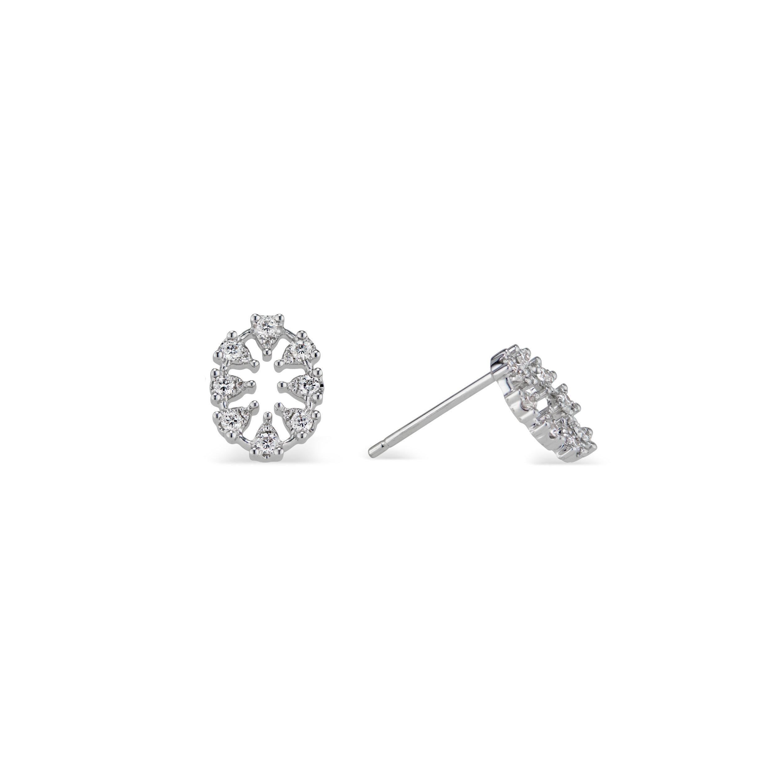 Triangles of brilliant white diamonds create an oval in this unique stud earring. French for “dream”, the Reve Oval Diamond Earrings lives up to its definition, creating an ethereal statement on the finger. In 18k white gold.


