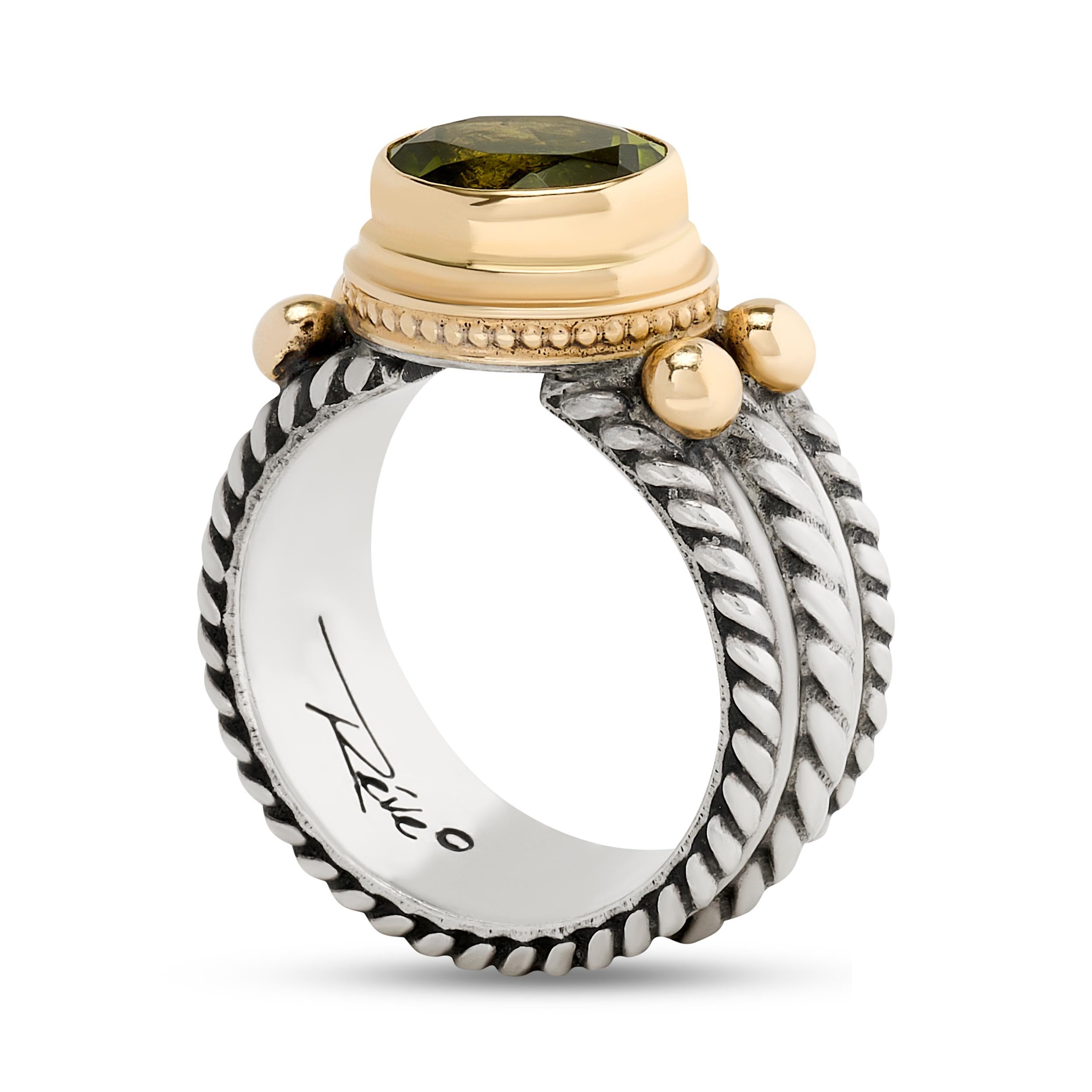 This Reve ring features a wide rope design in sterling silver, accented by warm 14-karat yellow gold and a vibrant peridot gemstone.

The oval peridot weighs approximately 3.00 carat.

Size US 8