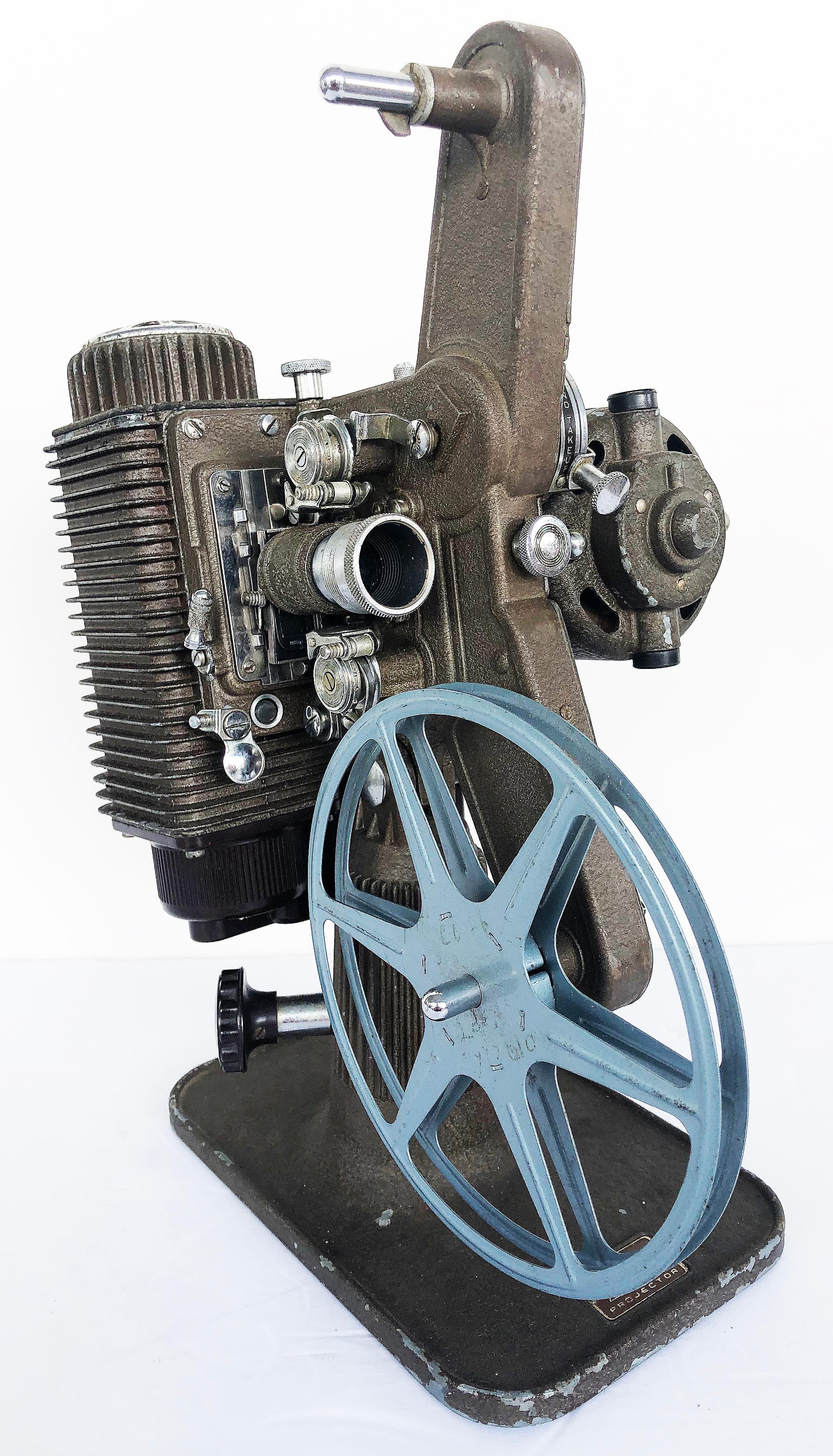 Revere Camera Co. Model 85, 8mm reel to reel projector with movies.

Offered for sale is a vintage Revere Eight Model 85 8mm reel to reel projector with 8 original movies. The projector has been tested and is in working condition. It includes what