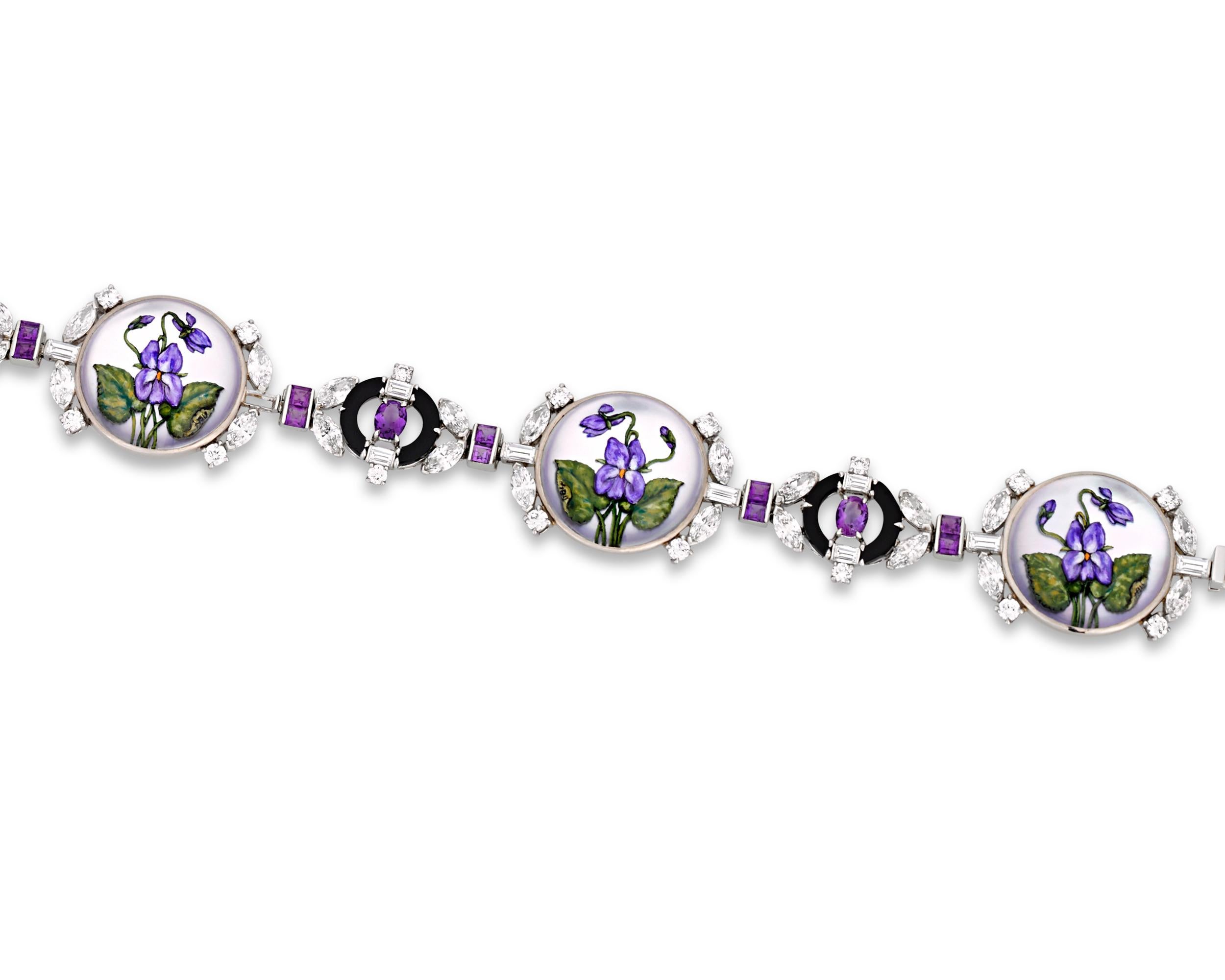 Beautifully hand-painted violets are visible through the Essex crystals set in this elegant bracelet by Raymond Yard. This jewelry creation is executed in the 