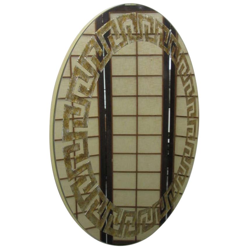 Reverse gold leaf Greek key mirror by David Marshall.
 
