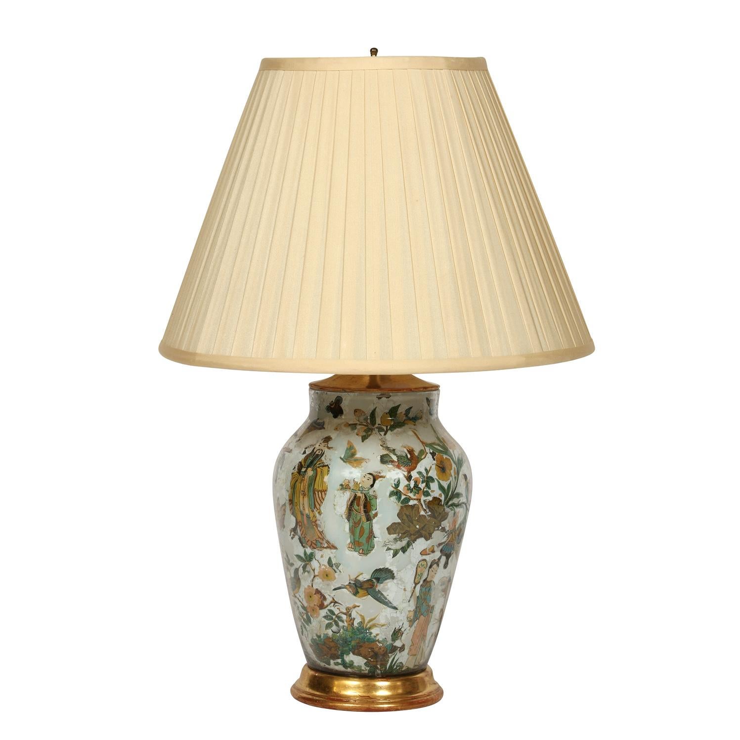 Reverse glass painted chinoiserie vintage lamp with gilt base and silk shade.