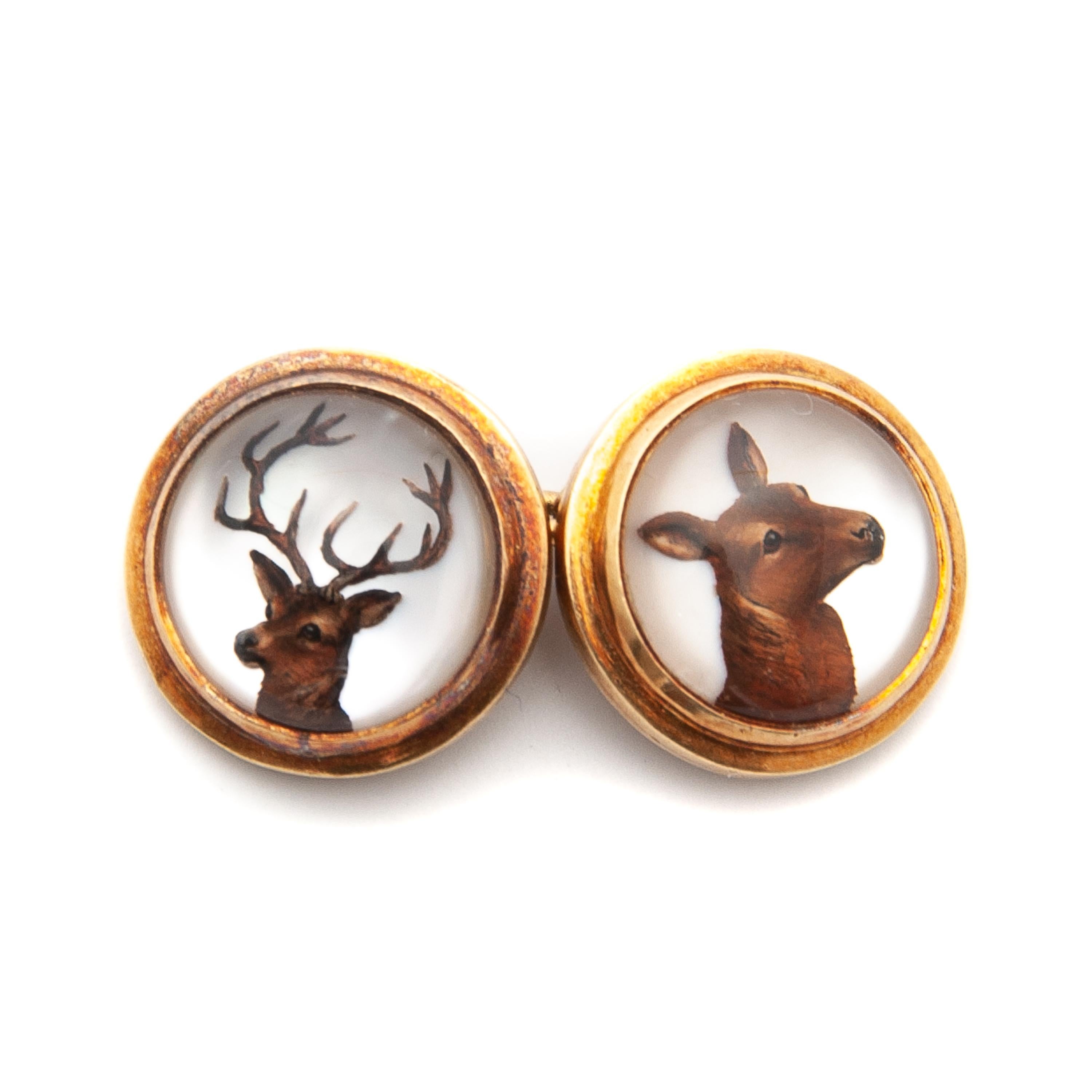 Reverse intaglio crystal cufflinks with forest animal scenes. The cufflinks each have a different wild animal carved in cabochon crystals. Each painting was done on the reverse carved crystal and has a mother of pearl background and all four images
