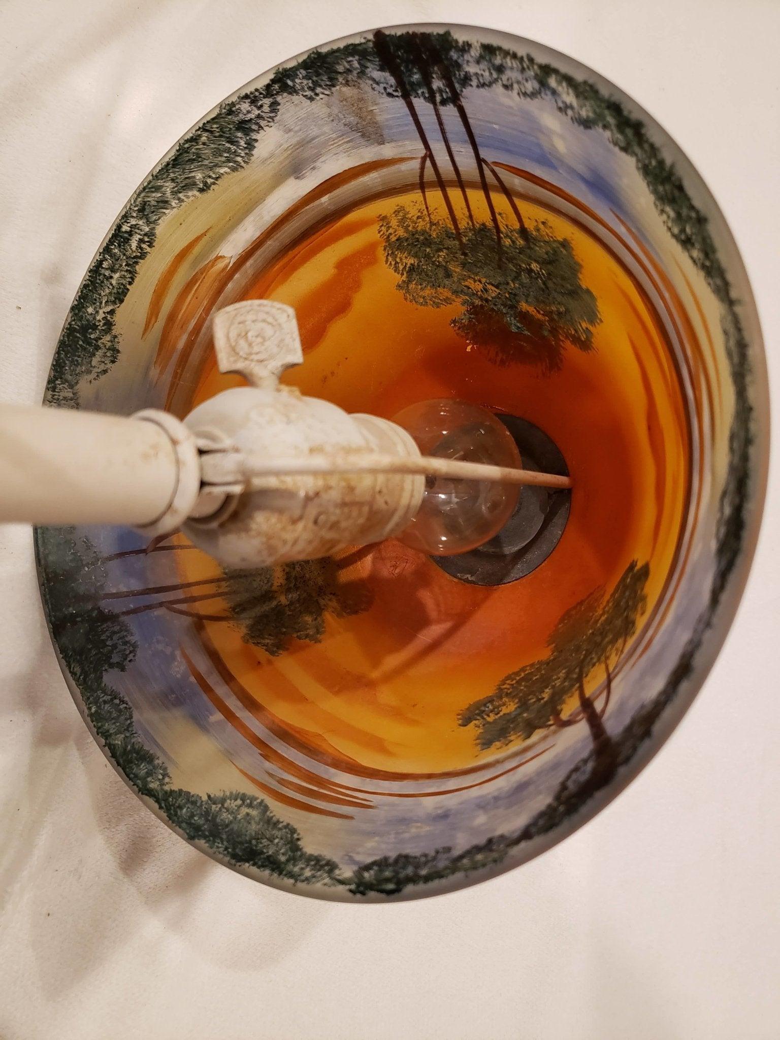 Wonderfully hand-painted sunset scenery reverse-painted on an 8 inch glass shade. The lamp base is nothing special, a standard white painted base, shade can easily be moved to any other glass shade lamp base to give it even more flare. Enjoy the