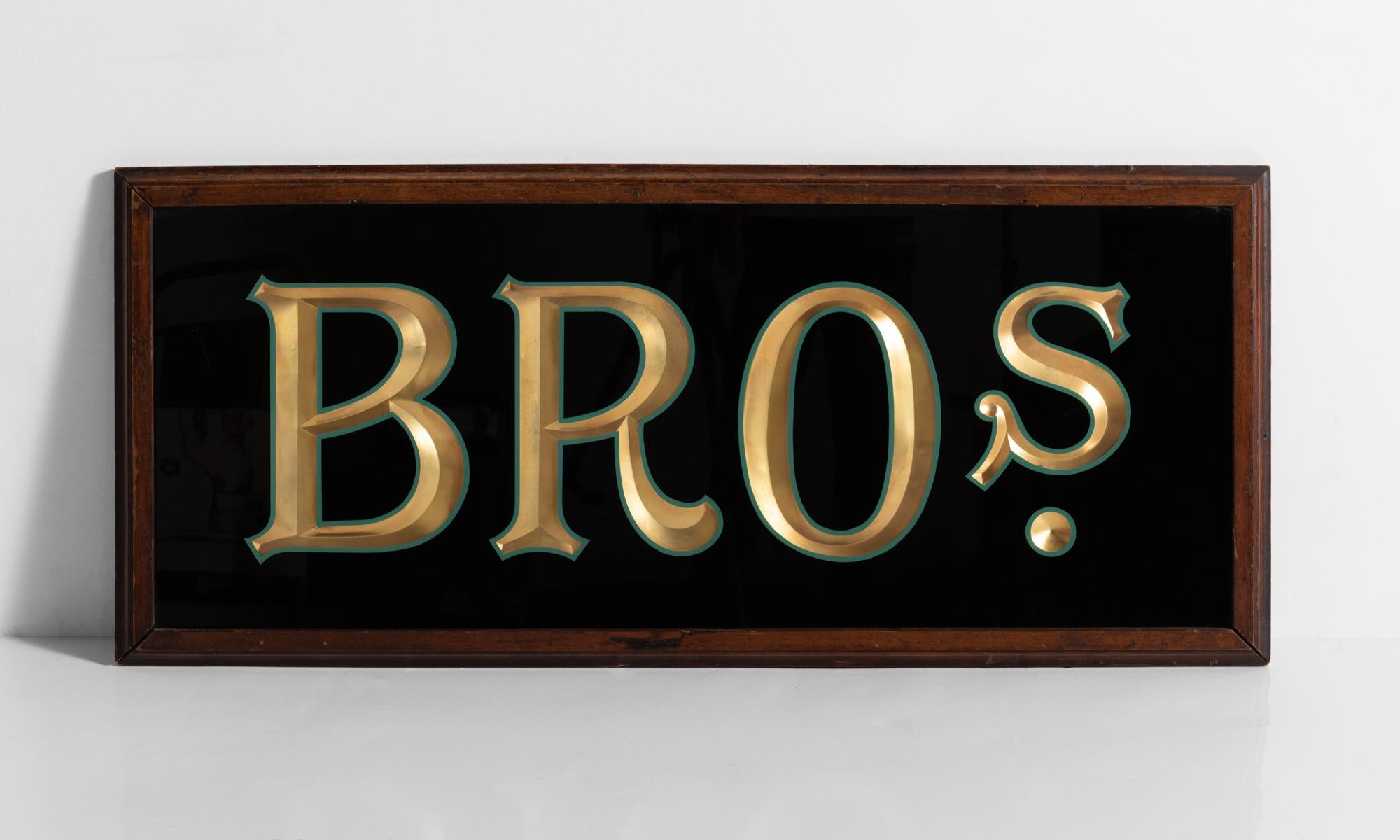 Reverse painted Bros sign, circa 1950.

Glass sign with beveled and hand painted detailing in wooden frame.