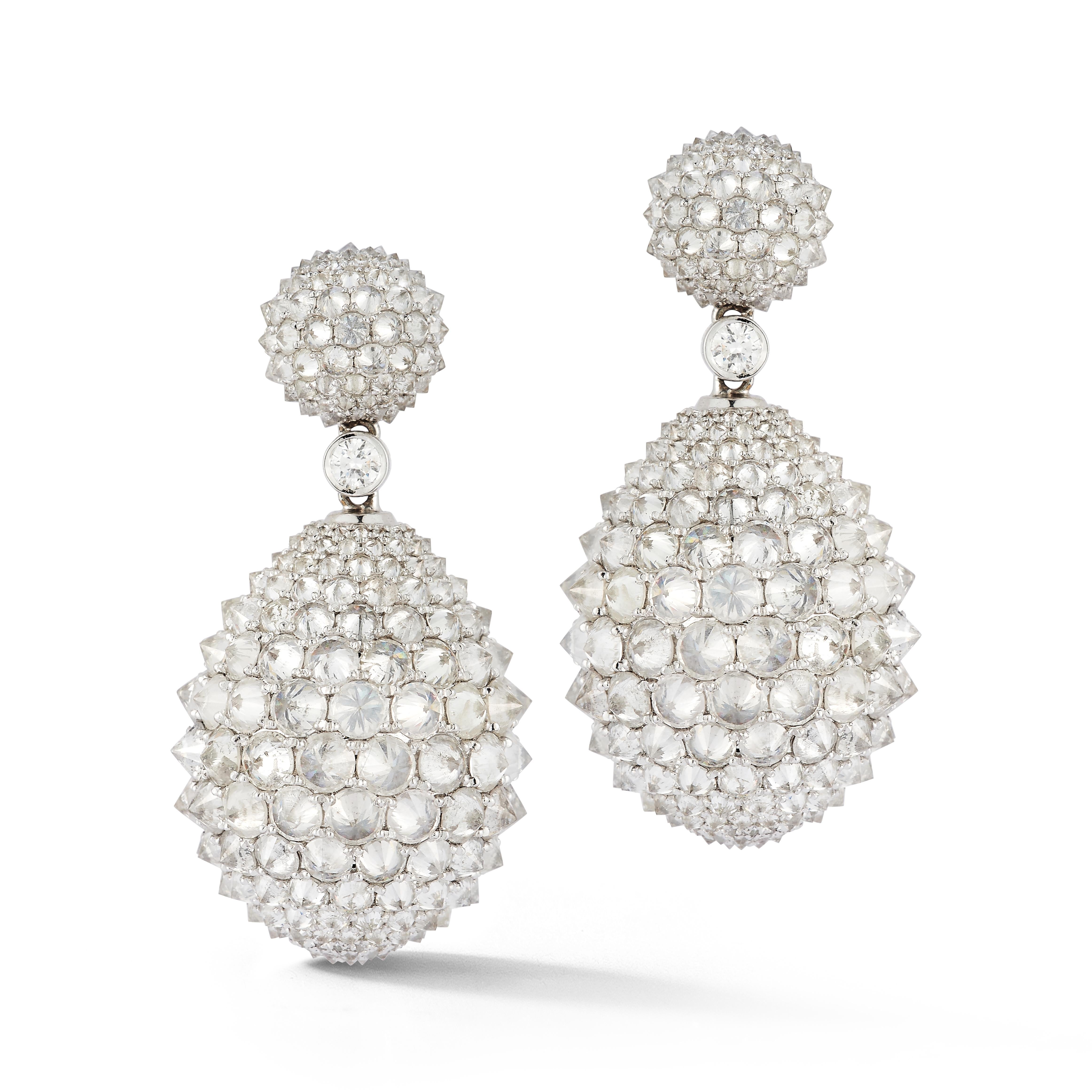 Reverse Set Diamond Earrings

A pair of 18 karat white gold earrings fully encrusted with reverse set diamonds

Total Diamond Weight: 26.18 carats

Length: 1.5
