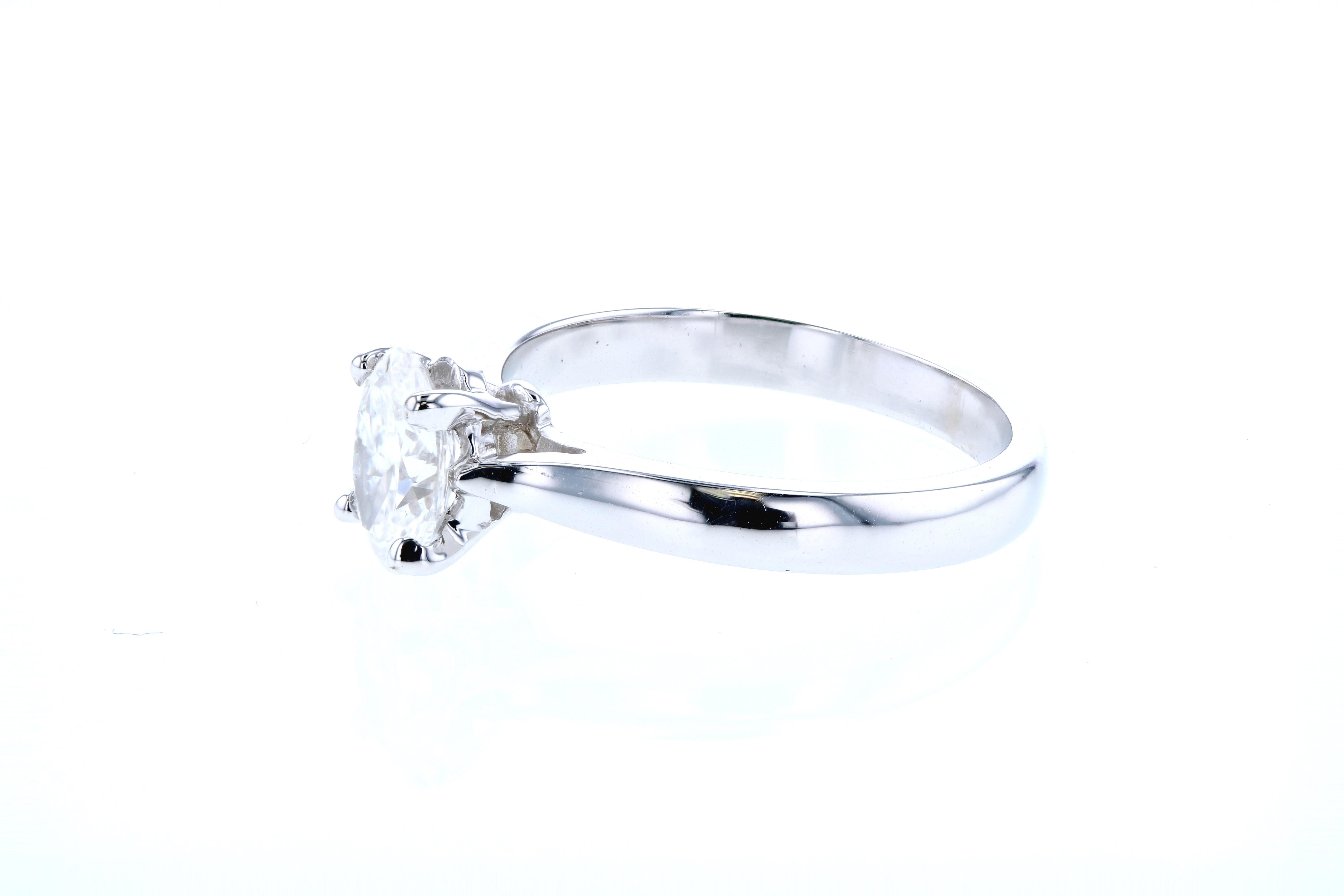 This reverse tapered engagement ring has a built-in (raised, cathedral) style setting and can be made in any color gold or platinum and customized for any shape center diamond.

Each piece we make is customized to our client's specifications. 

