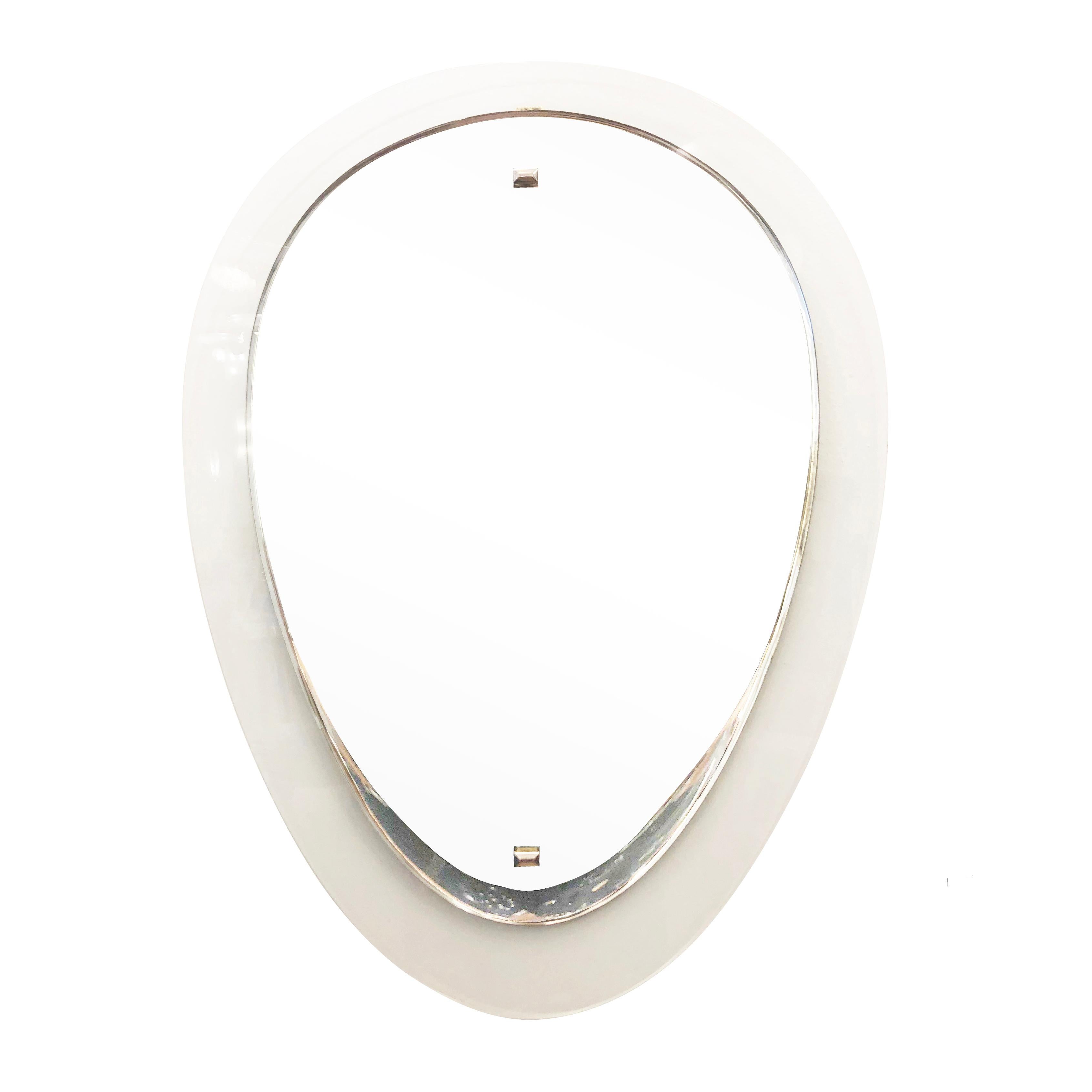 Italian midcentury mirror by Cristal Art in the shape of reverse teardrop. Noteworthy is the bevel on the mirror which gives the piece depth. Hardware is polished nickel. 

Condition: Good vintage condition, minor wear consistent with age and use-