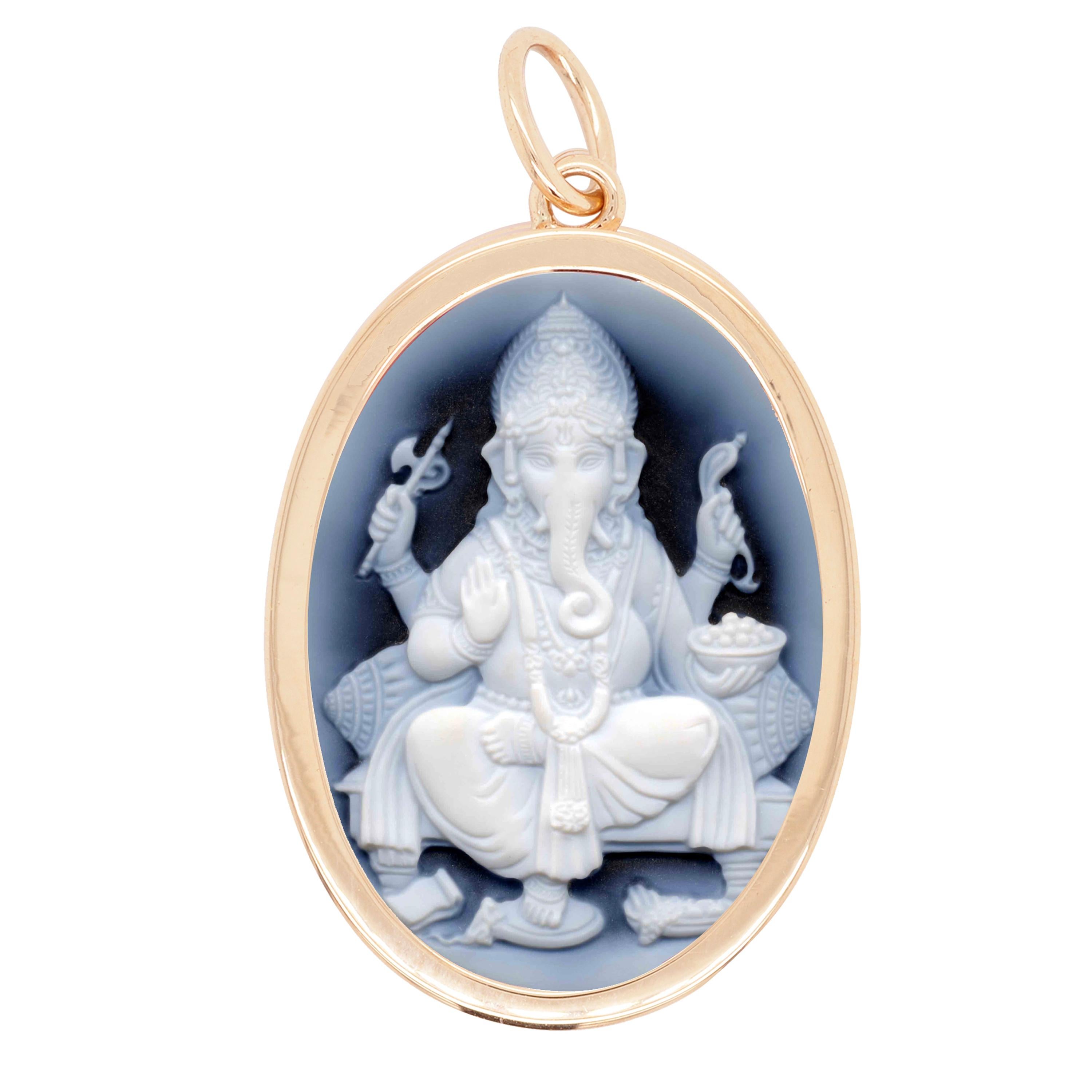 Reversible 14 karat yellow gold ganesha agate cameo om pendant necklace.

Get two pendants in one with this reversible necklace in 14 karat yellow gold ganesha agate cameo om pendant necklace. The pendant is set in 14 karat gold features ganesha