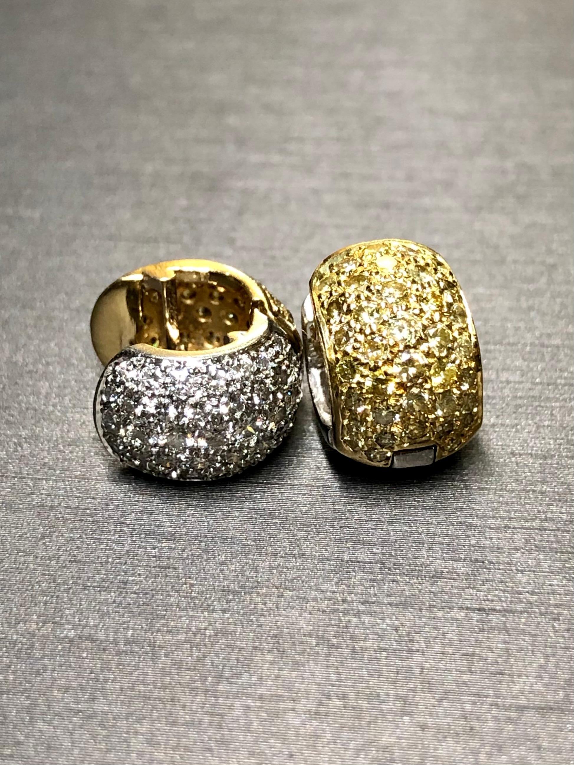 An elegant and understated pair of pavè diamond Huggies crafted in both platinum as well as 18K yellow gold and set with approximately 1.48cttw in fancy yellow diamonds (we strongly believe them to be natural color) as well as 1.48cttw in G-H color