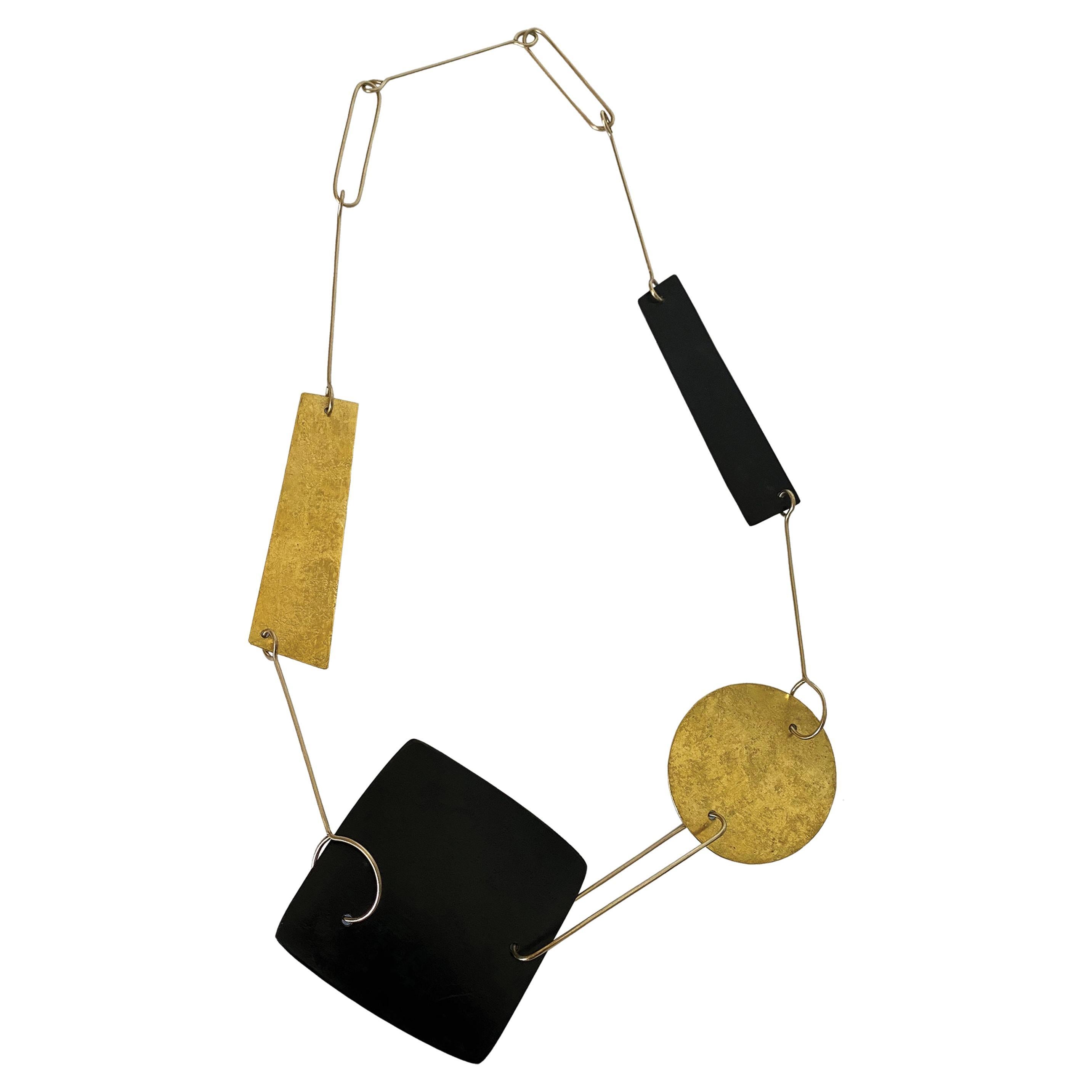 Reversible 9k Gold Patinated Steel and Hammered Silver Gold Leaf Shapes Necklace For Sale