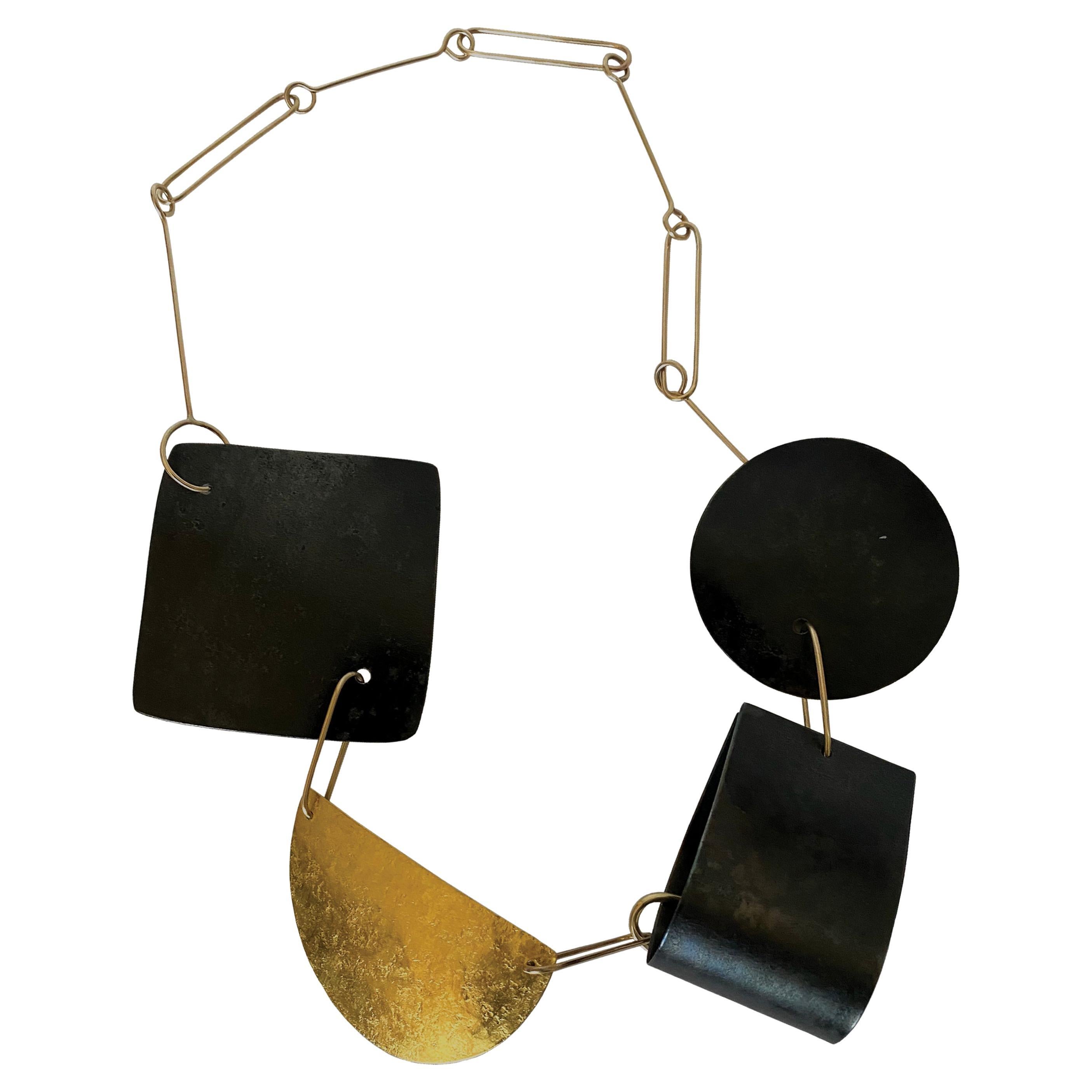 Reversible 9k Gold Patinated Steel Gold Leaf and Hammered Silver Shapes Necklace For Sale