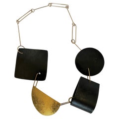 Reversible 9k Gold Patinated Steel Gold Leaf and Hammered Silver Shapes Necklace