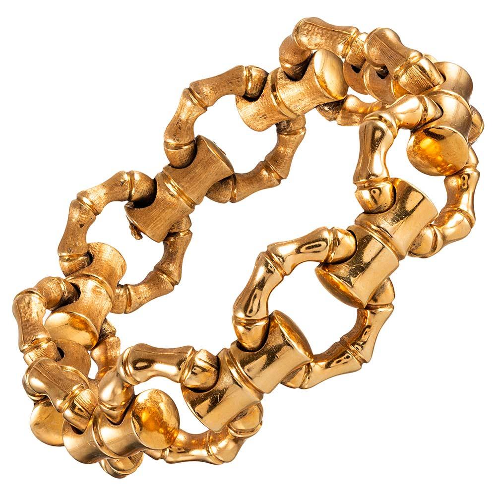 Cleverly designed with one side high-polished and one side satin-finished, this 18 karat yellow gold bracelet will make a lovely compliment to your attire. The organic charm of the bamboo theme is both whimsical and sophisticated, reminding