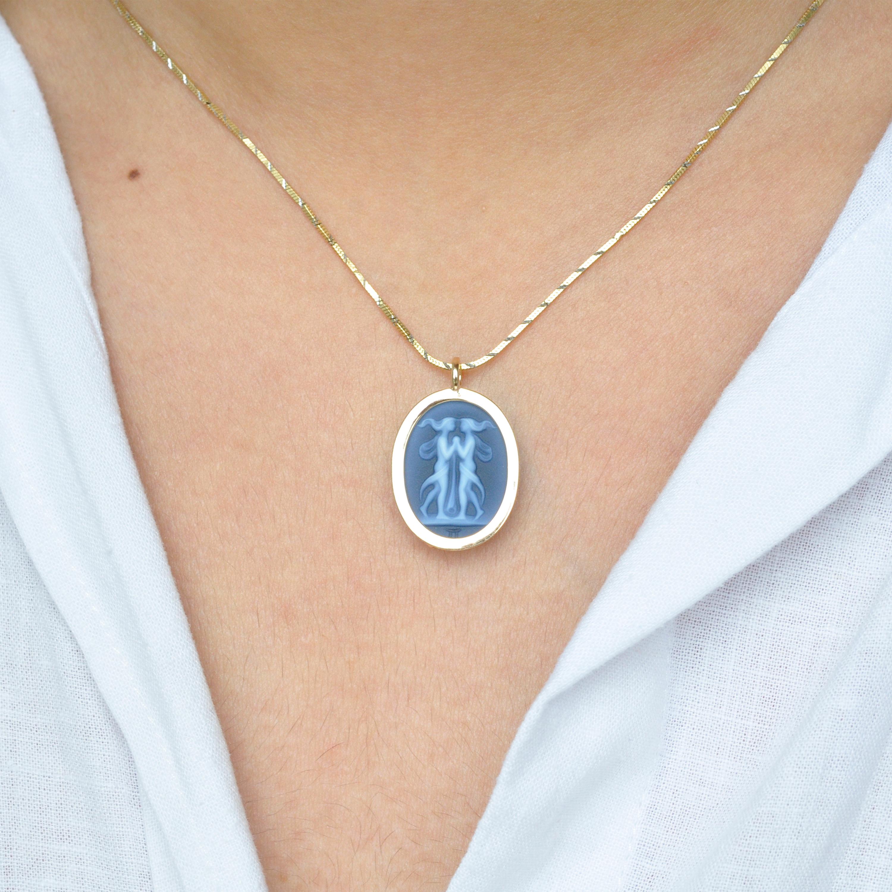 The reversible pendant necklace featuring a Gemini sun sign carving cameo zodiac diamond in 14 karat gold is a stunning piece of jewelry that combines exceptional craftsmanship, elegance, and personalization. With its reversible design, it offers