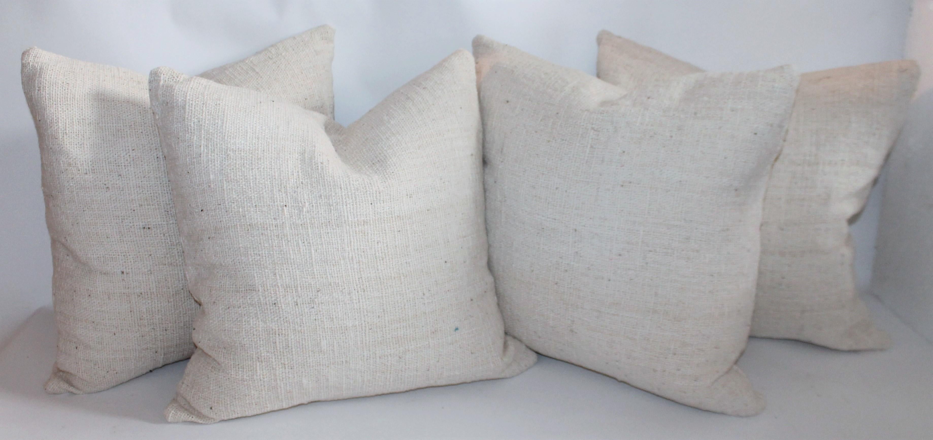 19th century homespun linen pillows that are reversible and down & feather fill. Sold as a group of four pillows These pillows are so organic and natural woven fabric.