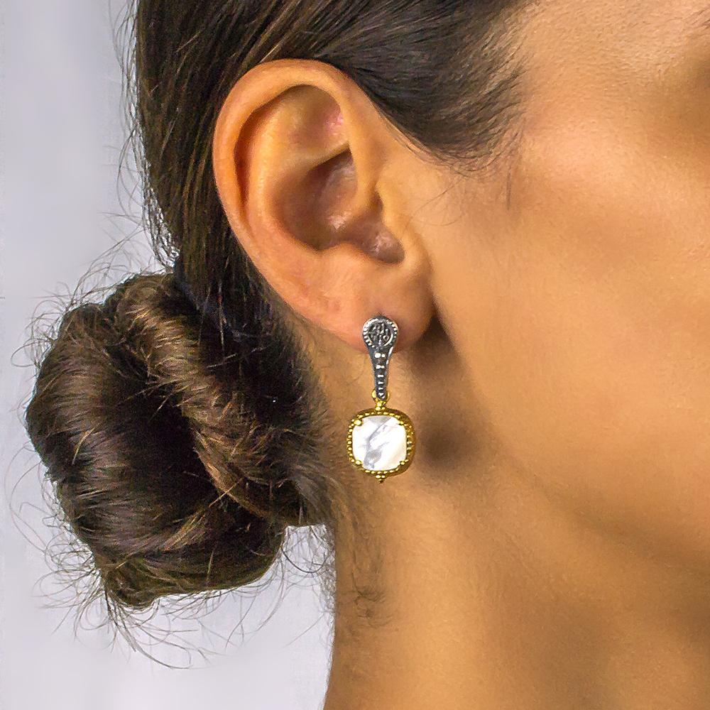 Two-sided sterling silver earrings with mother of the pearl, Swarovski crystals in gold plated ornate bezels.

Our inspiration in this collection is the two faced god of the Romans Janus, as they can be worn on both sides with the signature