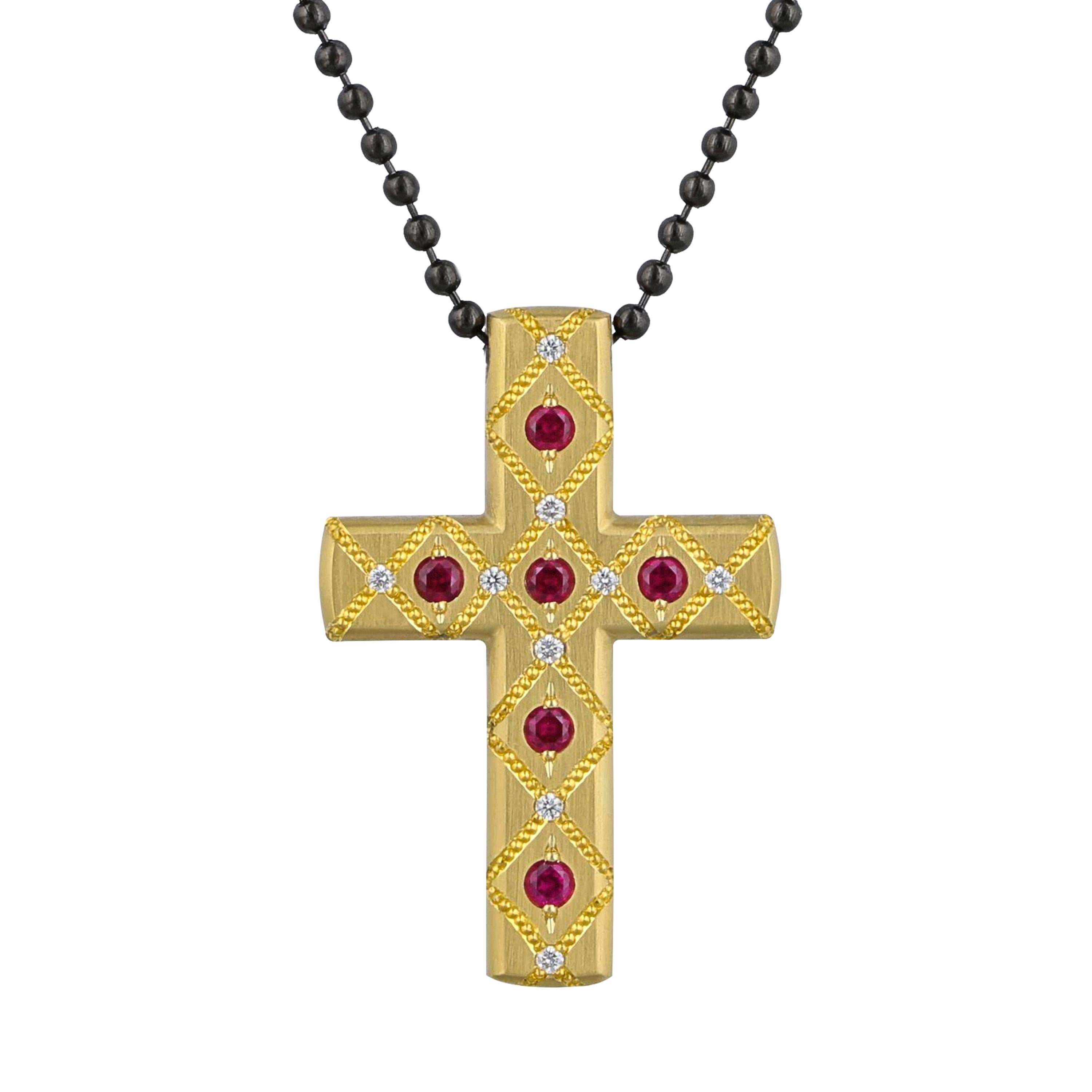 Reversible cross - 18K gold on one side with pure 24K gold hand engraved shaped inlay in Zoltan David signature pattern, accented with six .04 ct. Rubies and nine .01 ct. Diamonds. The other side is platinum with a .08 ct. Paraiba Tourmaline. It is