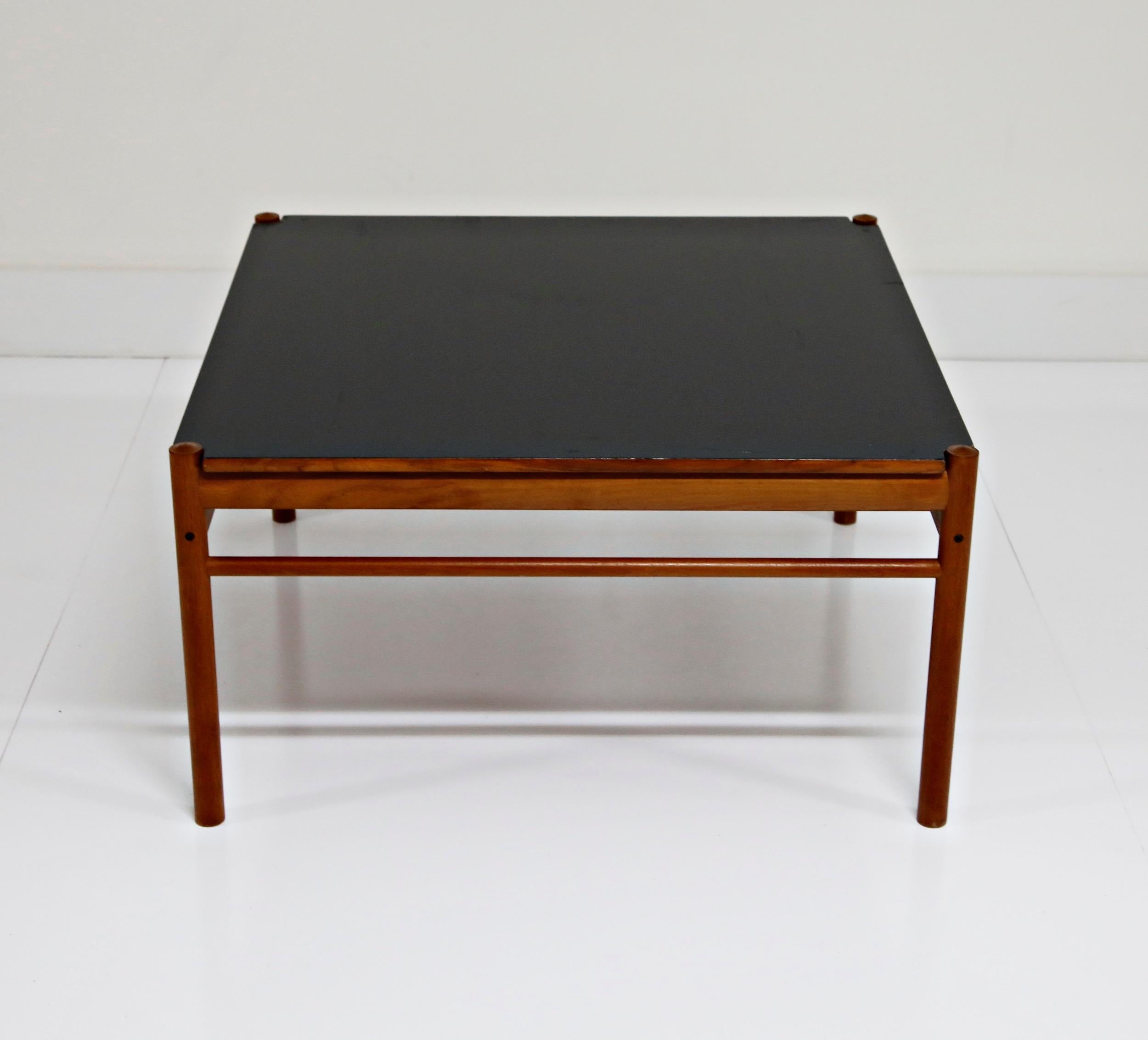 A classic 1960s reversible coffee table by Ole Wanscher for Poul Jeppesen, which can also be used as an end table, side table or occasional table. Also, with the clever use of Formica for one side of the tabletop, consider using in a kids room -