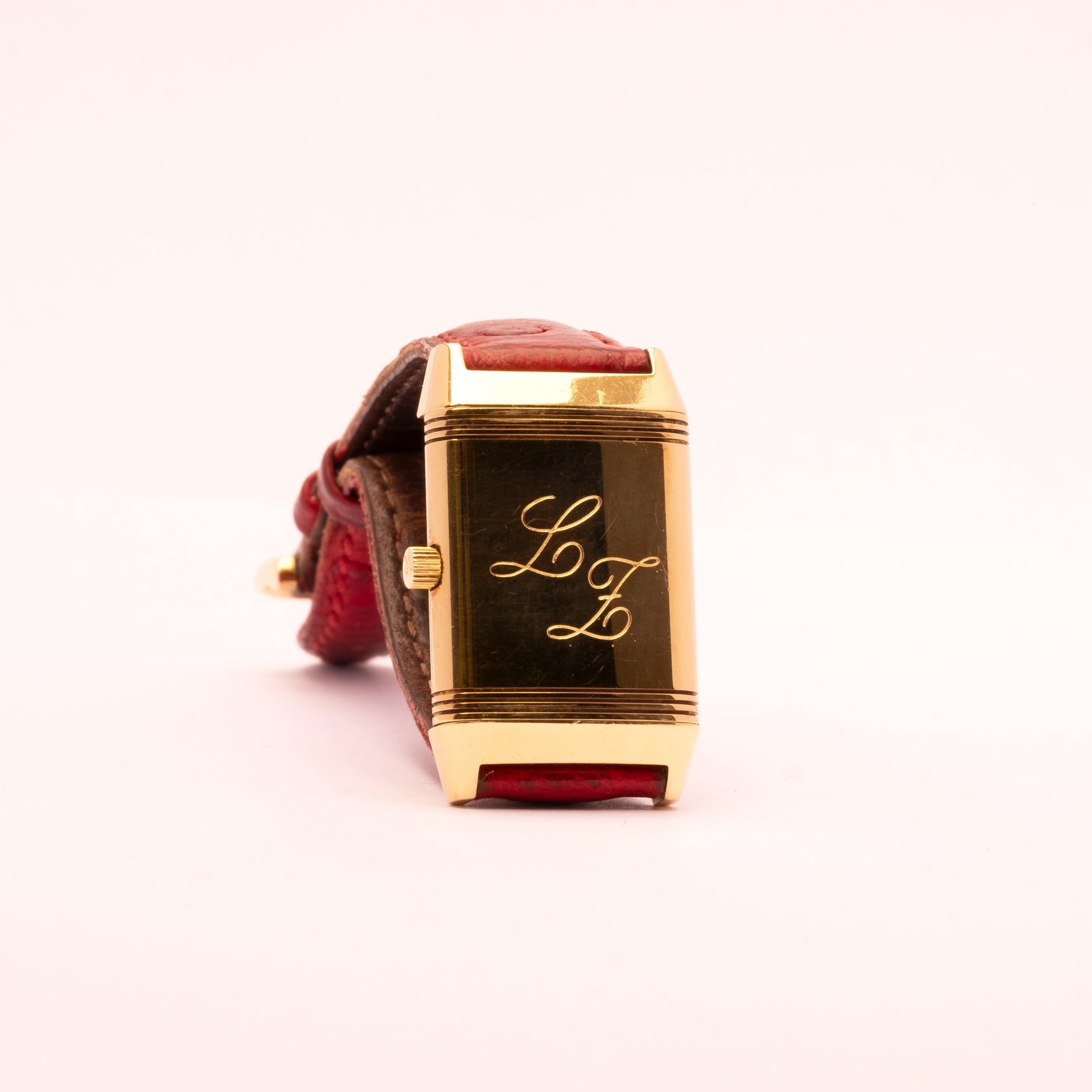 Reverso Jaeger-LeCoultre in 18kt gold, small size for lady. Manual winding mechanical movement, with 18ct gold pin buckle. Comes with box and guarantee purchased in 1996. Ostrich strap from Jaeger-LeCoultre and a new Jaeger-LeCoultre croccodile
