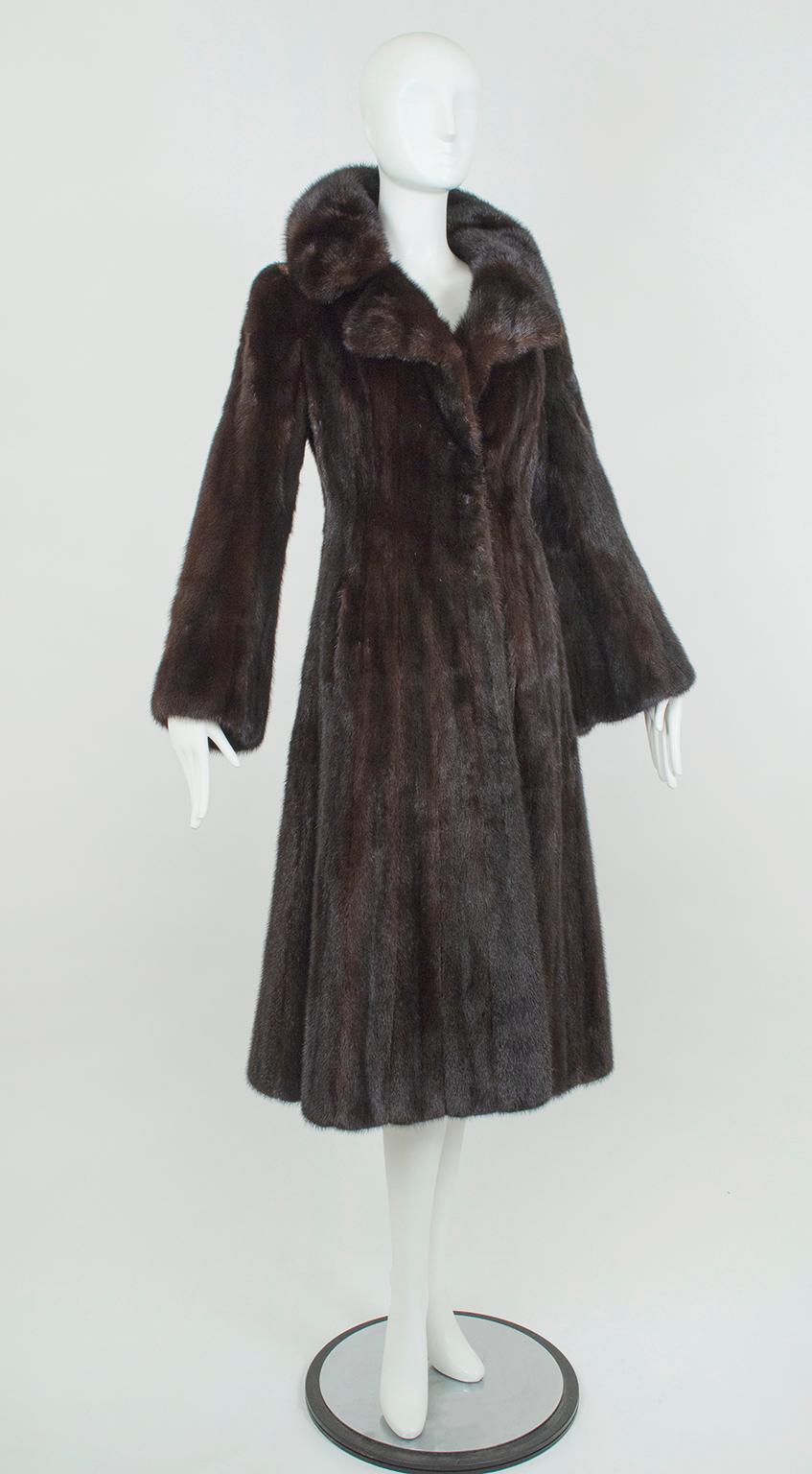 The mink to end all mink coats, this extraordinary Revillon features a princess silhouette fit for a Russian Tsarina and a dramatic wide, notched collar that can be worn open, standing, or buttoned to the throat for extra warmth. Immaculately made