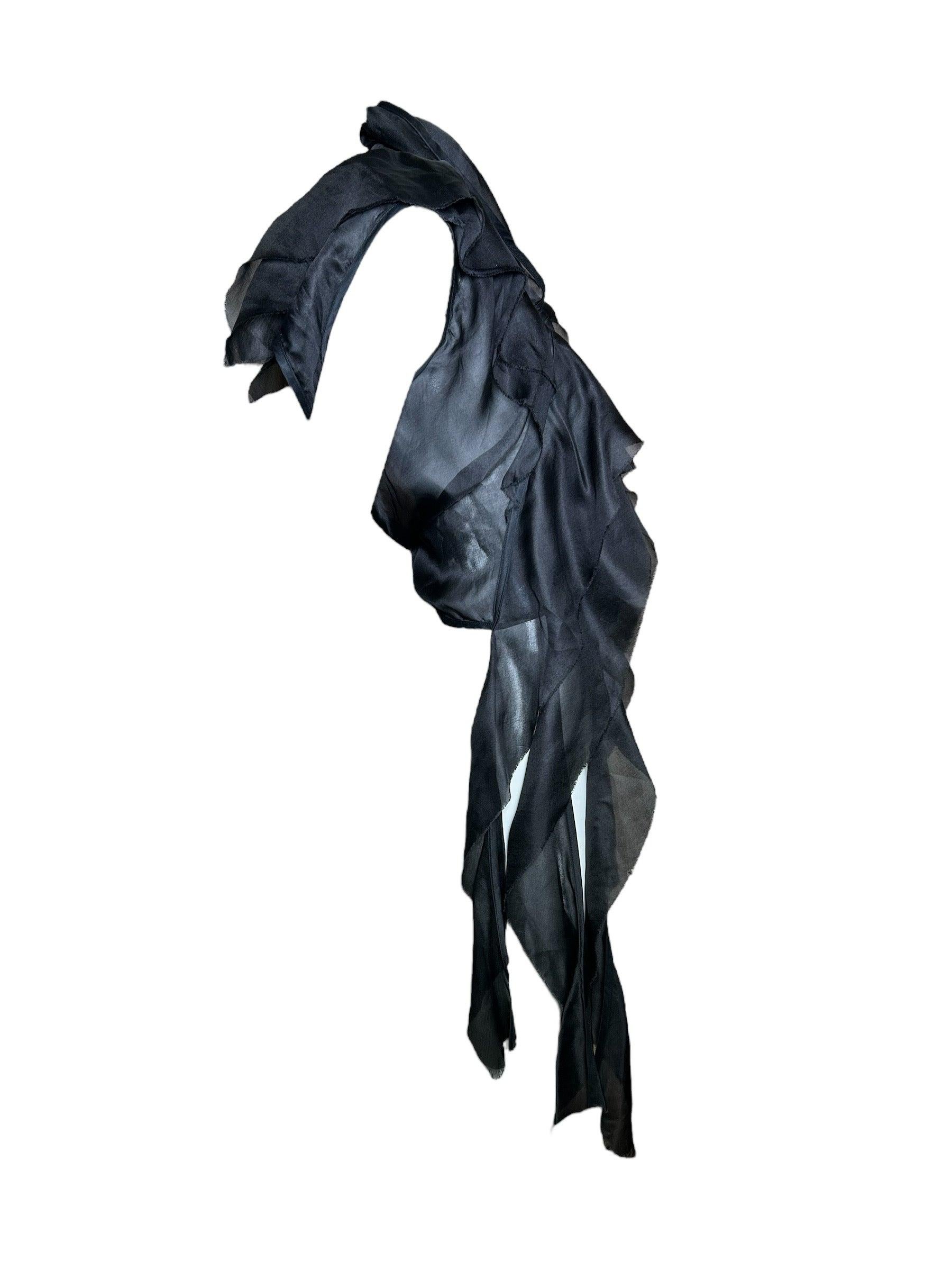 Rick Owens designed for Revillon from 2003-2006. The house of Revillon was famous for its fur coats took on a creative iteration under Owens. This incredible silk vest is very much in the style Rick Owens would establish for his own house. Black,