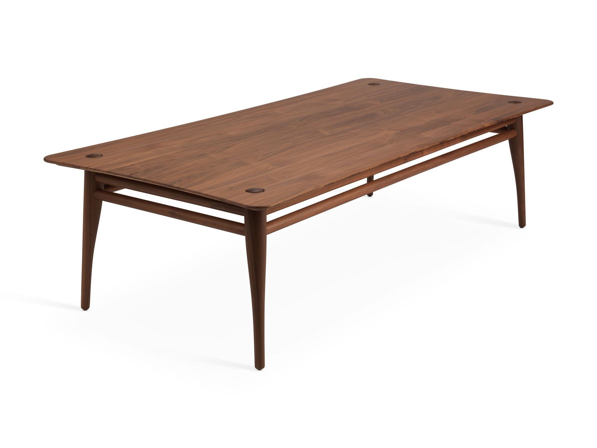 Chilgrove is a series of coffee tables crafted from a solid wooden frame and top which are gently curved. The wooden frame underneath the surface has four organic shaped legs which protrude elegantly through the surface of the table. The Chilgrove
