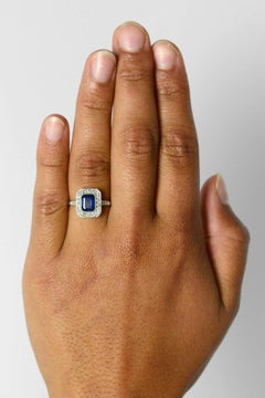 Revivalist Art Deco Sapphire Engagement Ring Emerald Cut Gemstone Diamond Halo