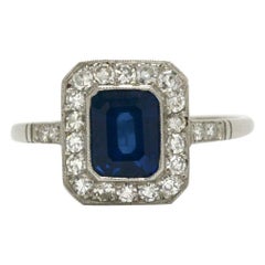 Revivalist Art Deco Sapphire Engagement Ring Emerald Cut Gemstone Diamond Halo