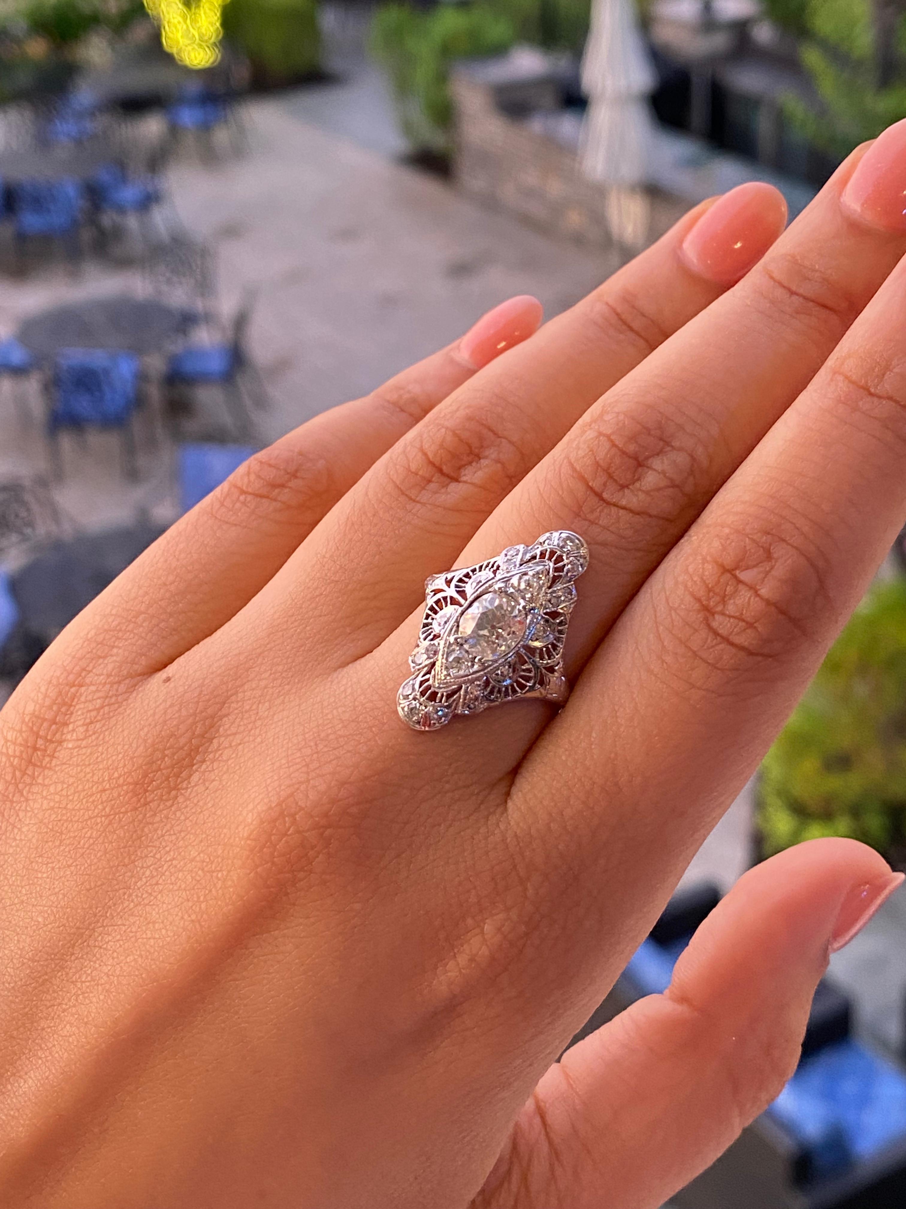 We love an old mine cut diamond for its soft rectangular shape and twinkling facets. This ring's elegantly elongated shape is enhanced by ornate openwork and hand-engraving all around.

Why we love it? The accenting single-cut diamonds add