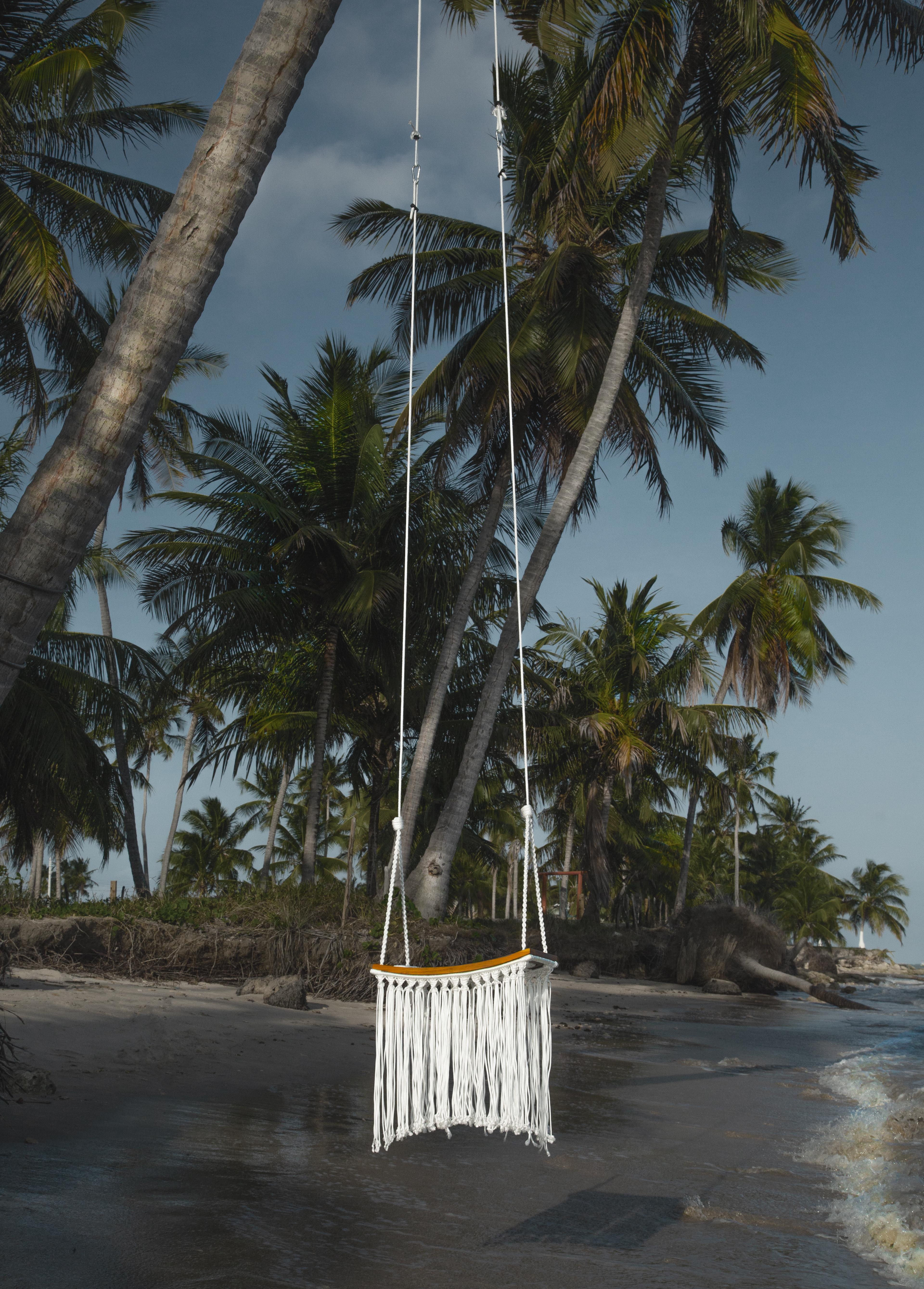 The Revoar swing is made entirely by hand with nautical macrame rope. 
The appreciation of manual work results in a sophisticated and exclusive design piece. 
The chains were represented in a three-dimensional form with rope braids. (Braided in 10